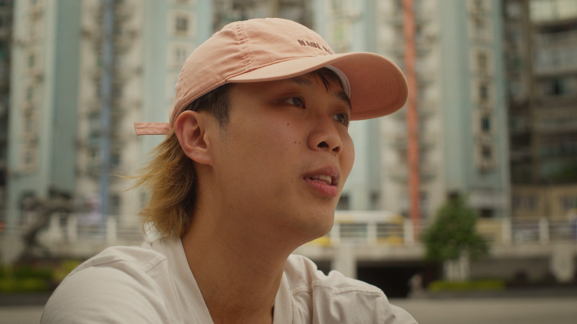 On The Line — portrait of a competitor in a pink cap