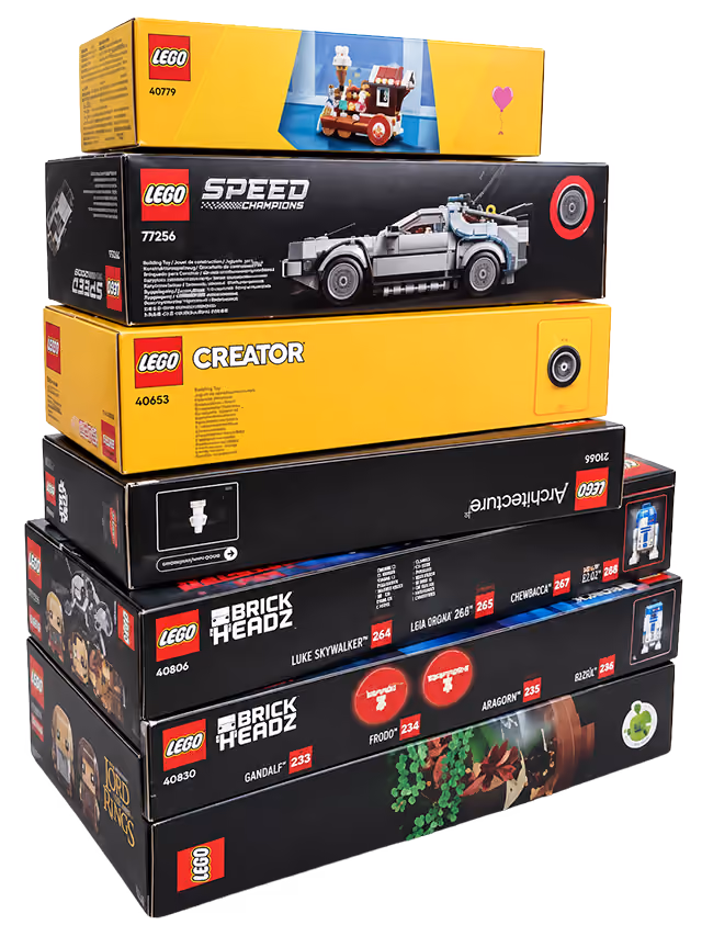 A stack of LEGO sets, unopened