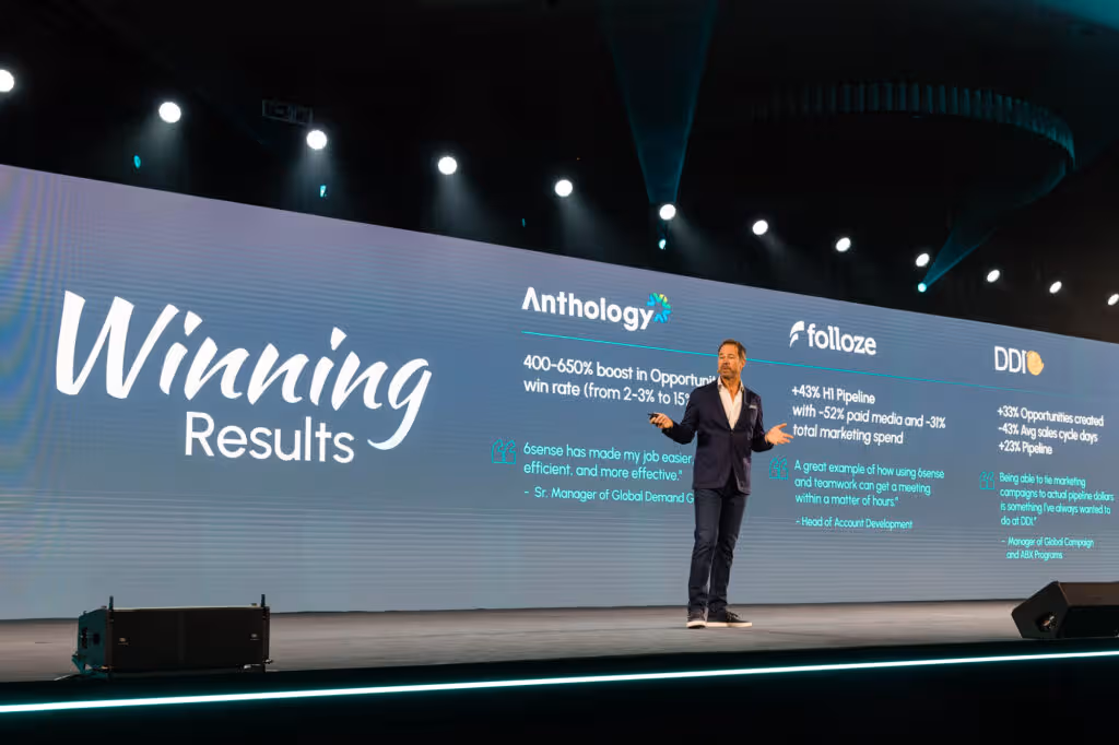 man on stage presenting