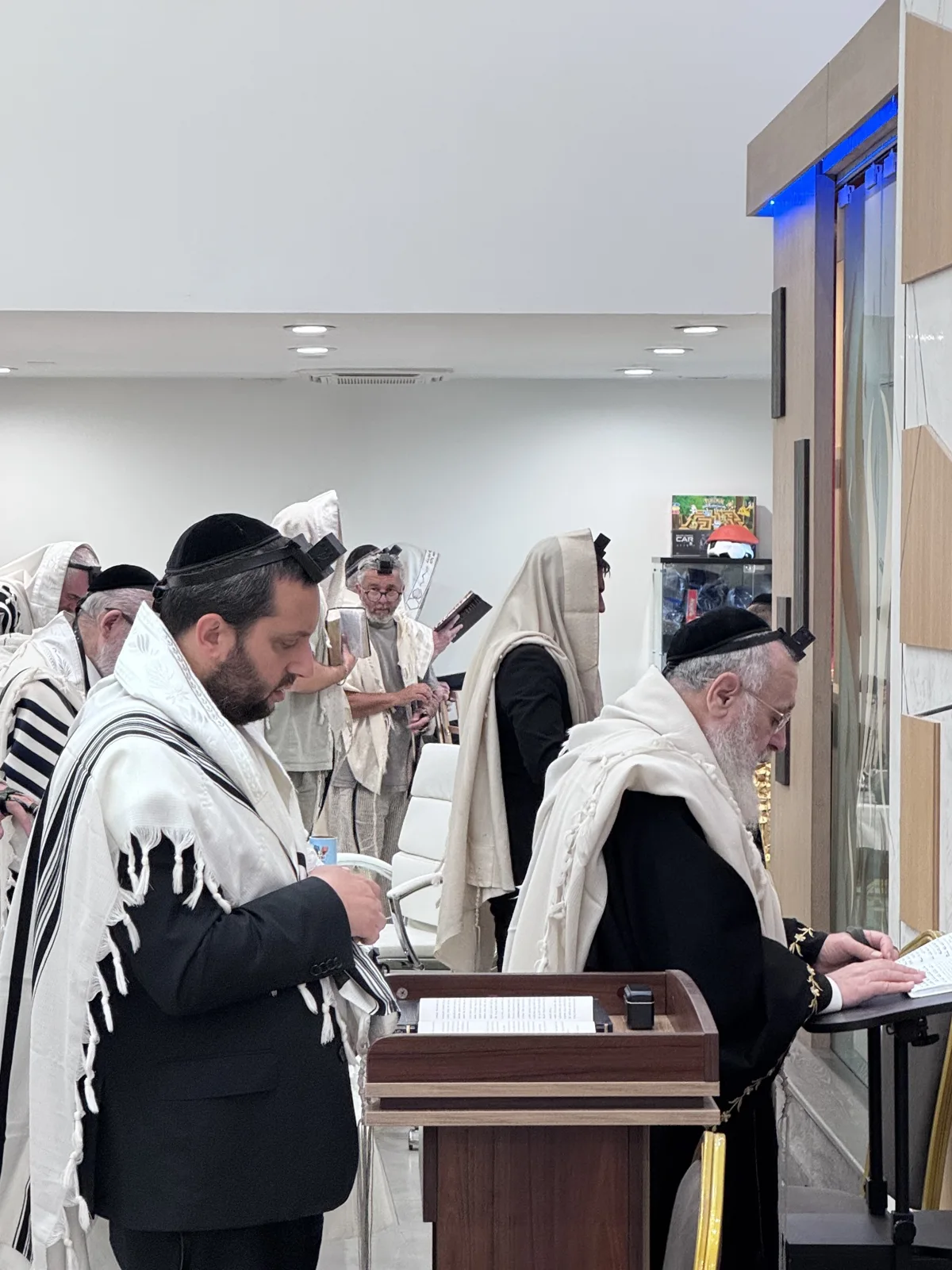 Community members praying at Shuvah Israel