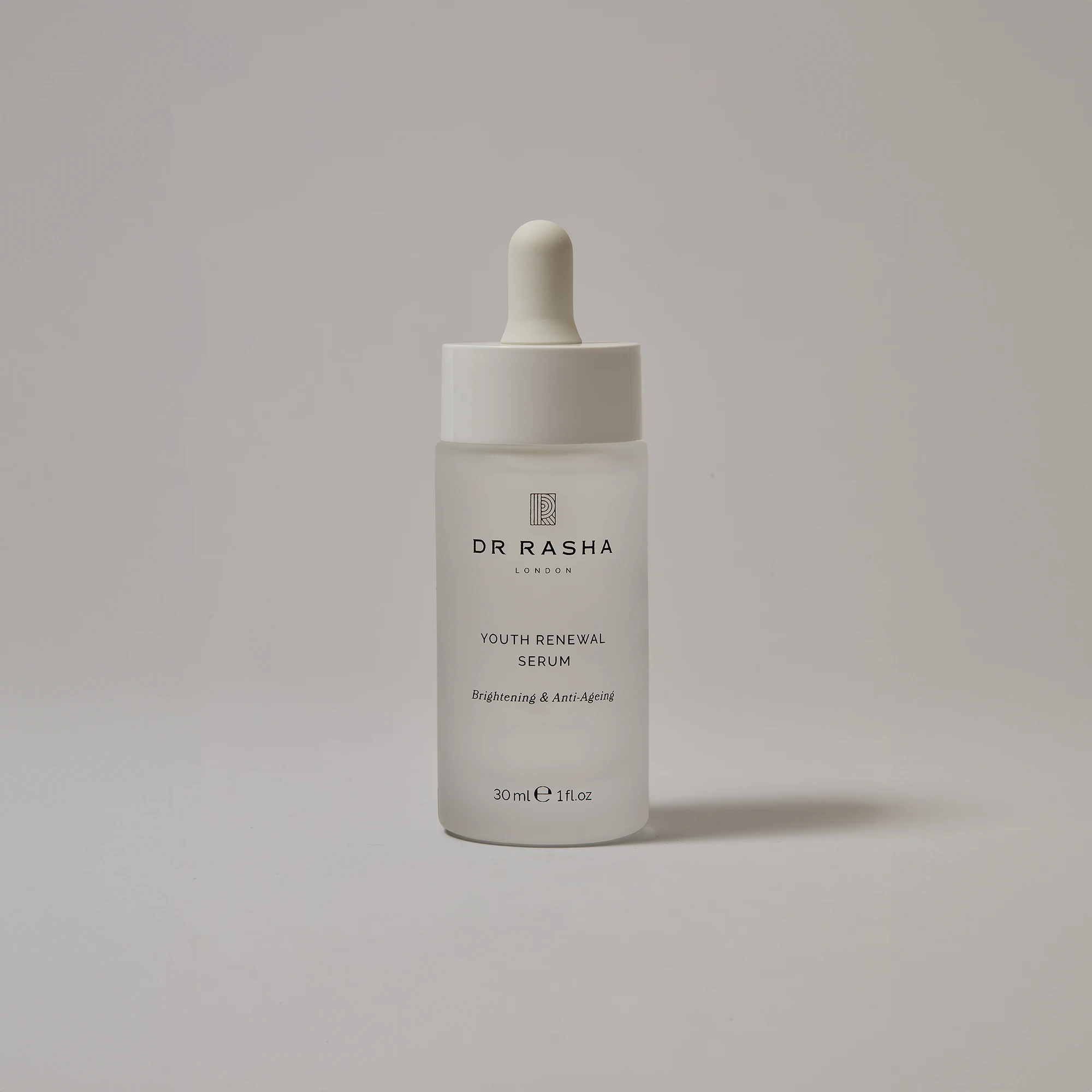 Frosted glass dropper bottle labeled Dr Rasha Youth Renewal Serum brightening and anti-aging.
