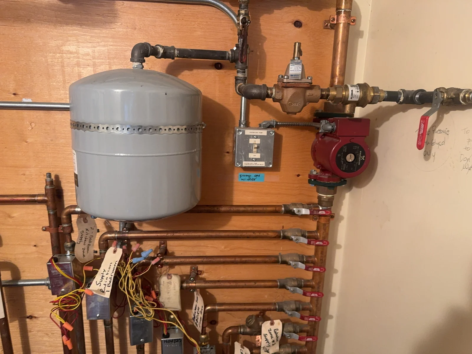 Hydronic piping with an expansion tank, circulator and valves.