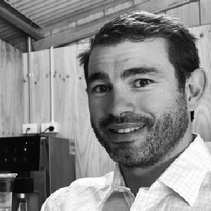 Man with facial hair smiling