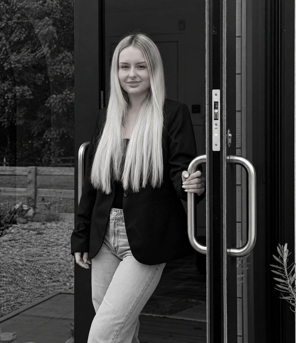 Tegan Fleming, founder of Novelle, standing at the clinic door