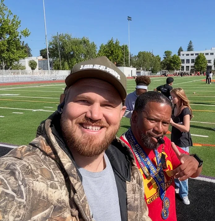 Owen with a Berkeley High coach at a football game