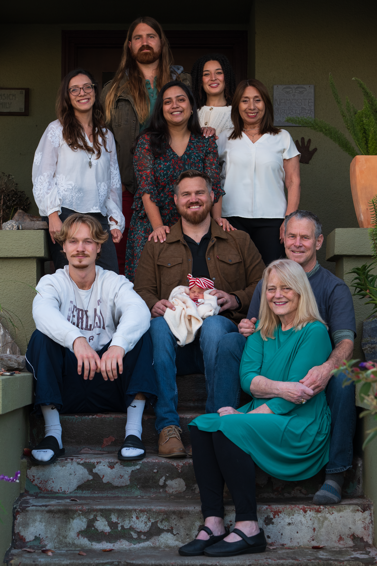 Owen with his family on the porch of their home