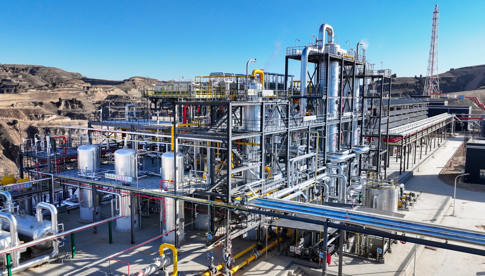Natural gas processing plant with vessels, pipework and access platforms