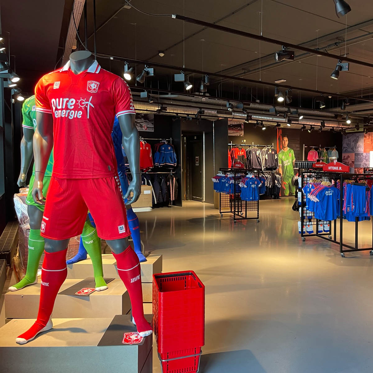 FC Twente club shop interior with replica kits and merchandise displays