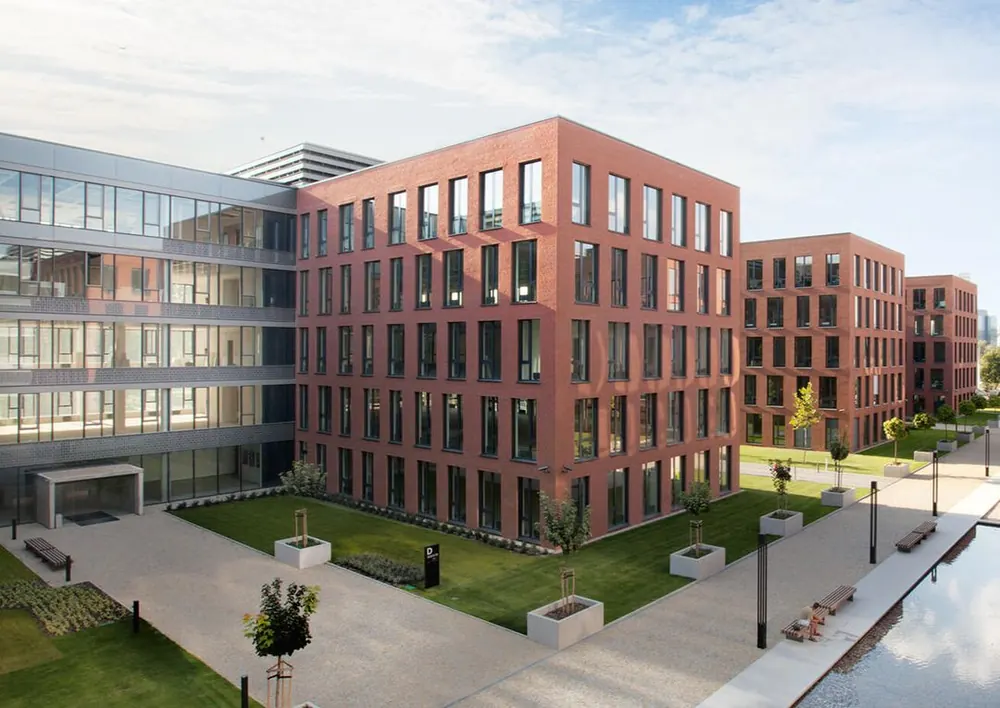 Red brick office buildings of the business park in Prague that houses the GoodVision research and development center
