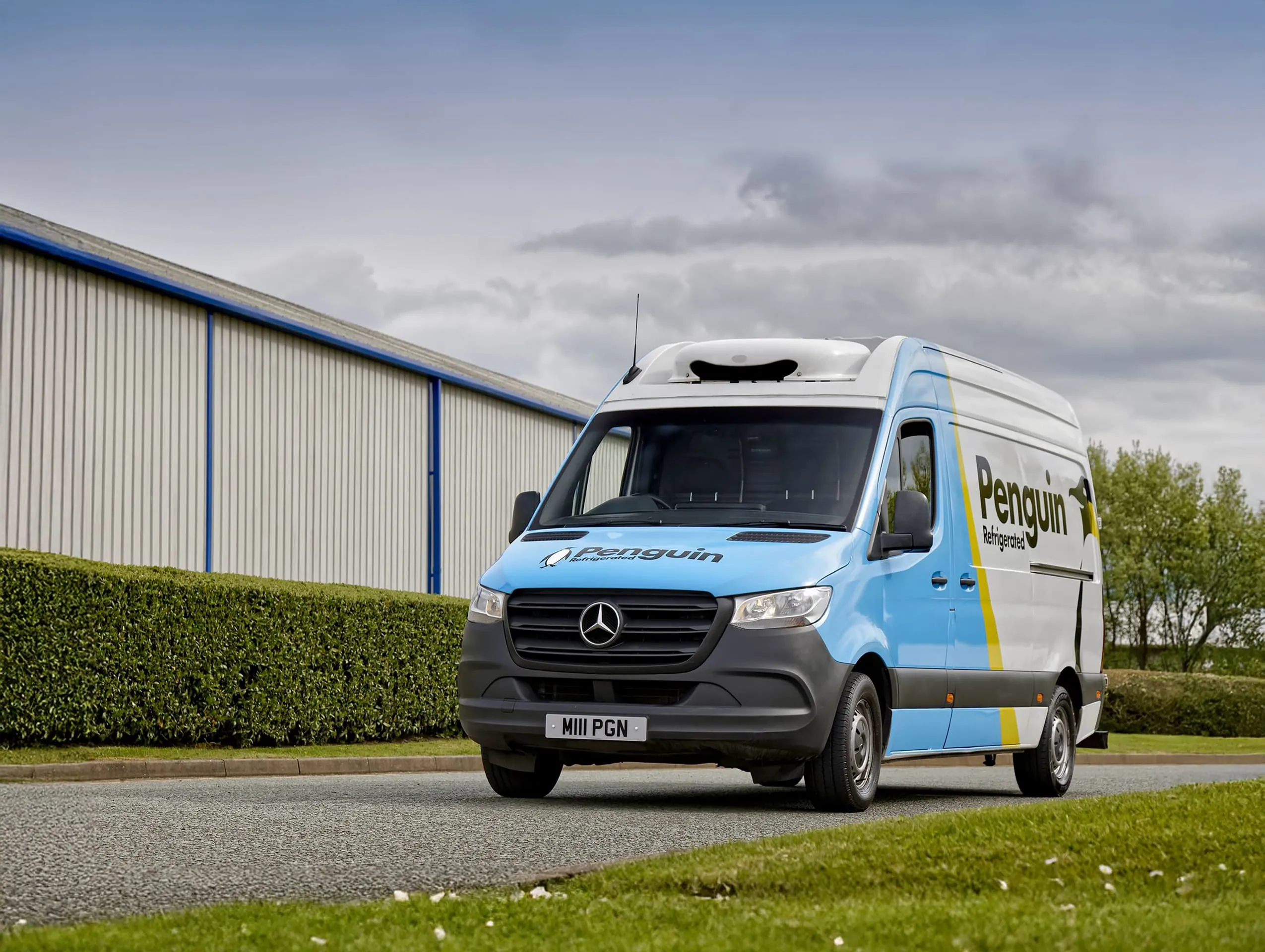 Penguin Refrigerated branded van outside an industrial unit