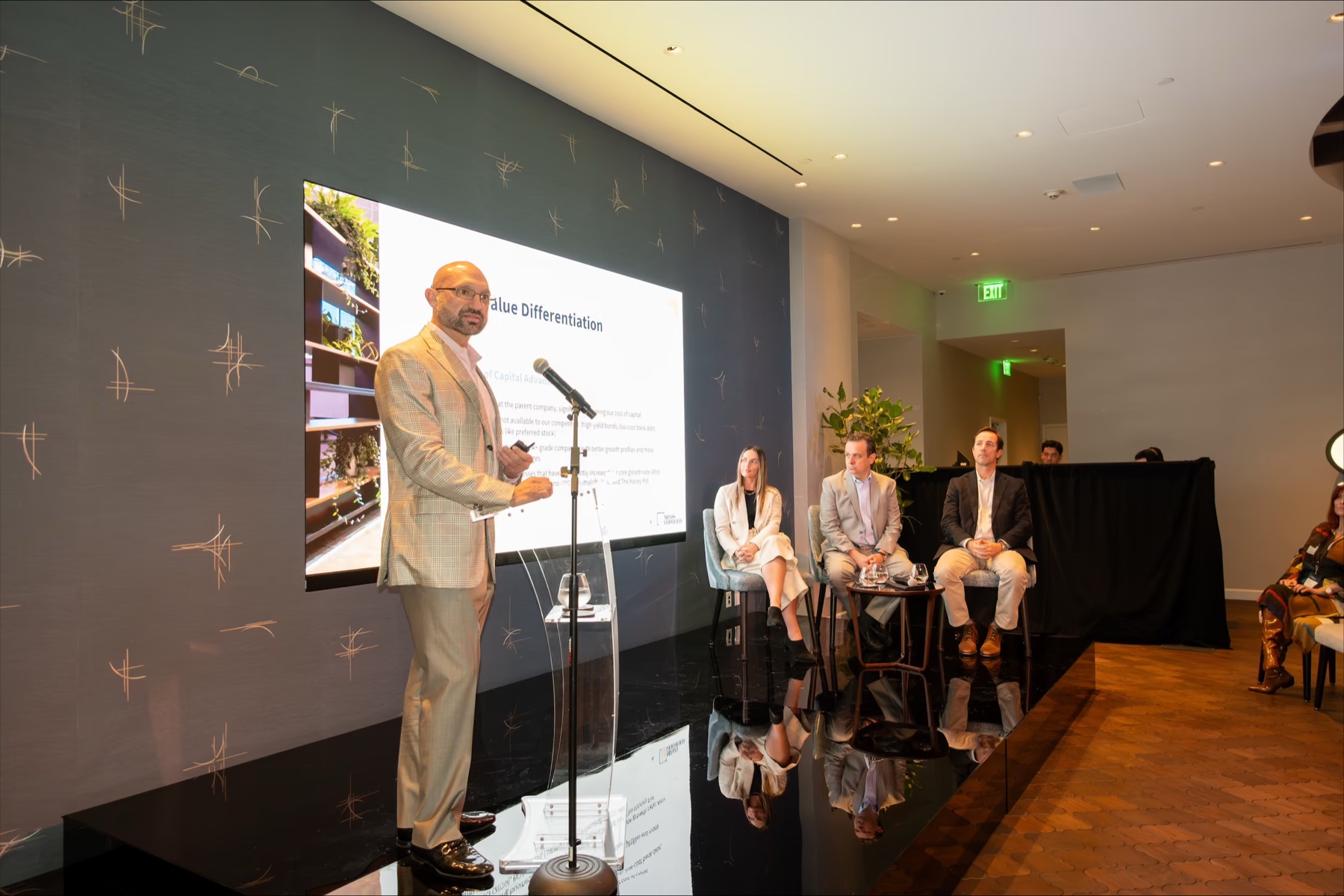 Presenter on stage at the Compass Diversified Investor Day