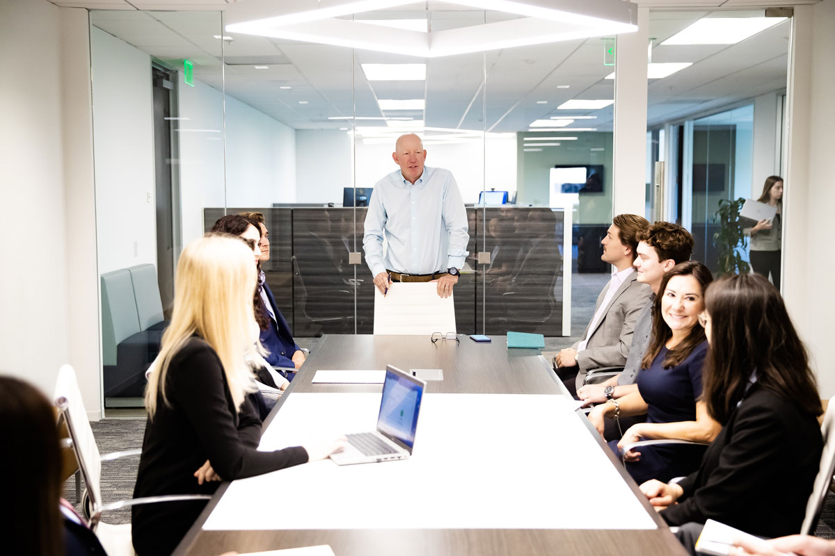 A senior advisor reviewing roadshow materials at his desk