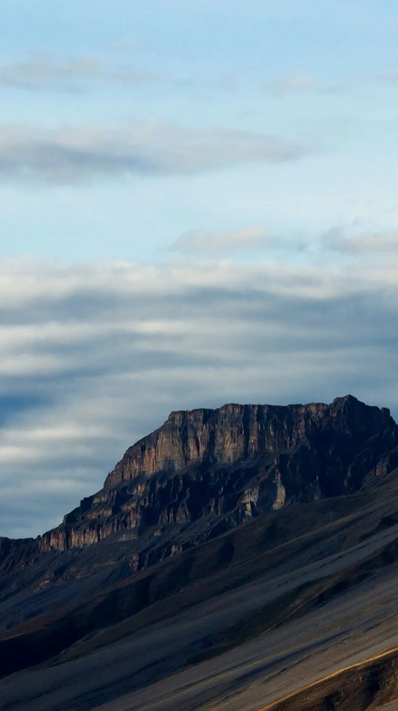 Mountain ridge under a blue sky