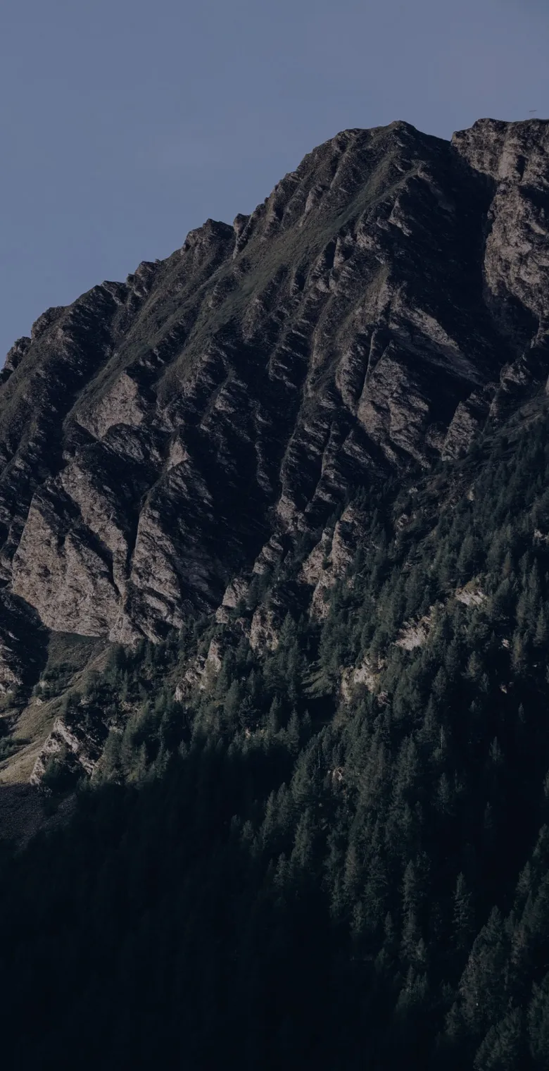 Green mountain ridge in split light