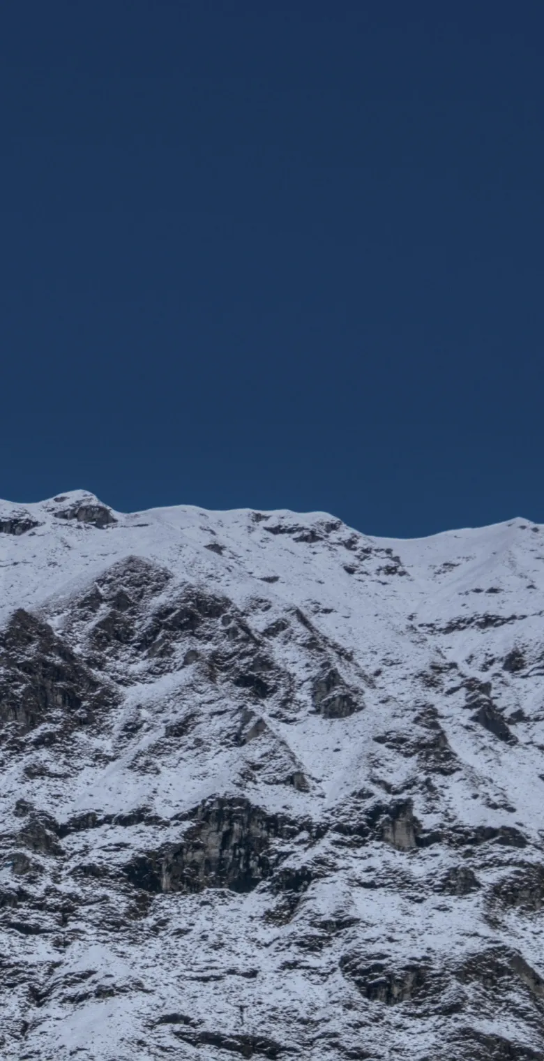 Snow ridge under an open sky