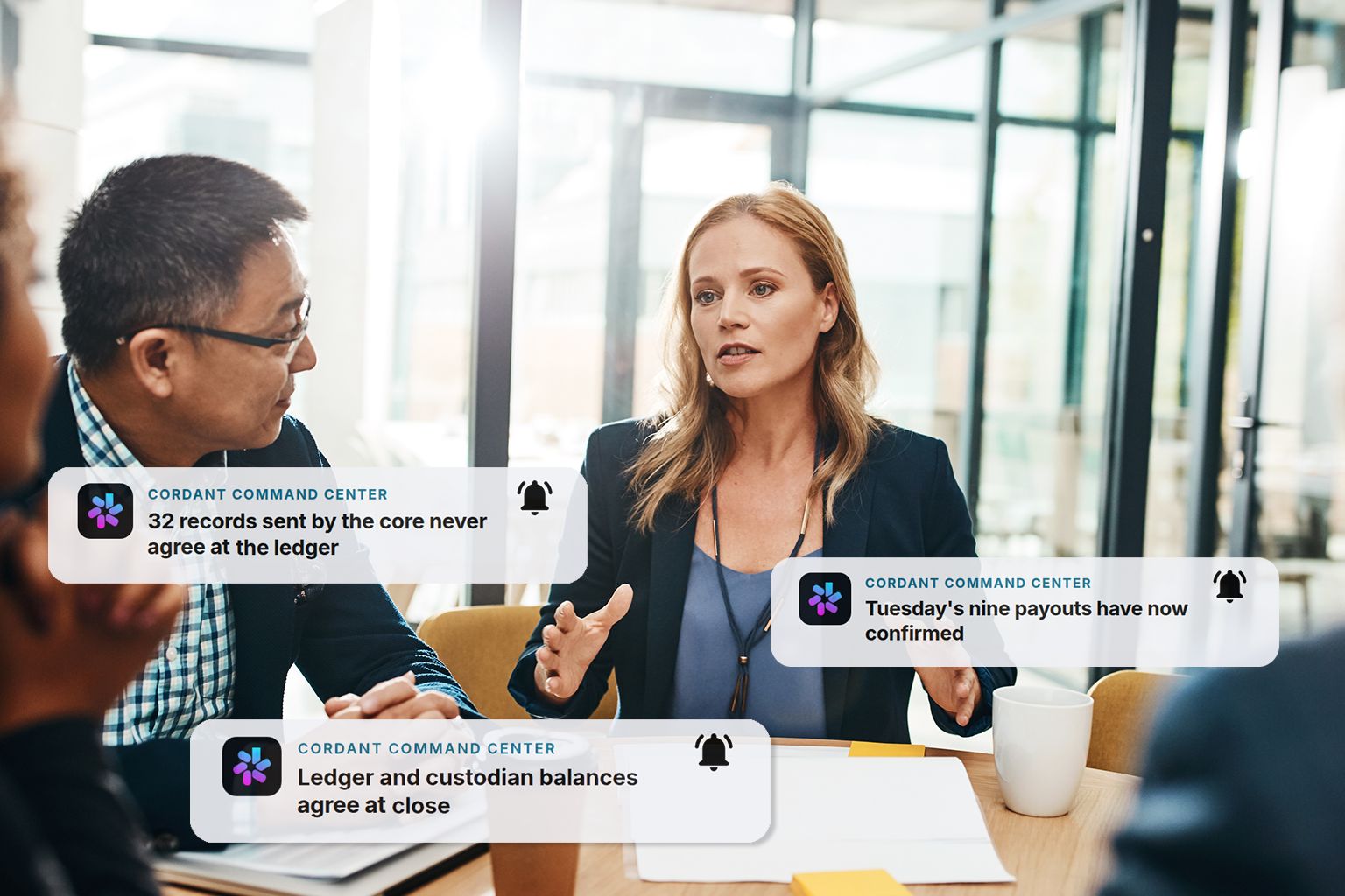 An operations meeting with Cordant alerts confirming reconciliation, payouts and ledger balances.