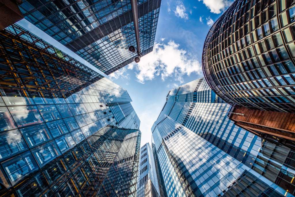Glass skyscrapers viewed from below.
