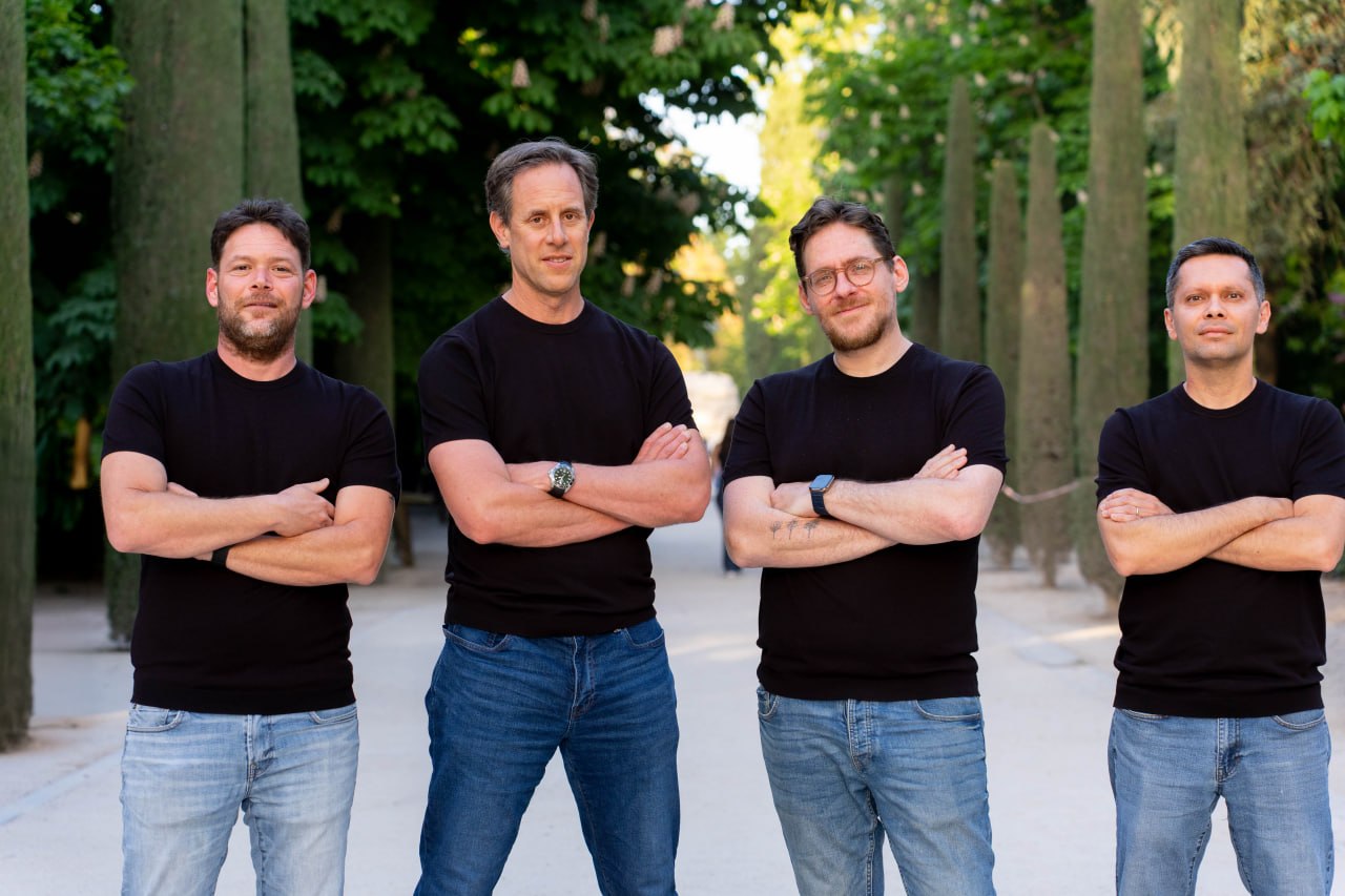 Cordant's four co-founders standing together outdoors.