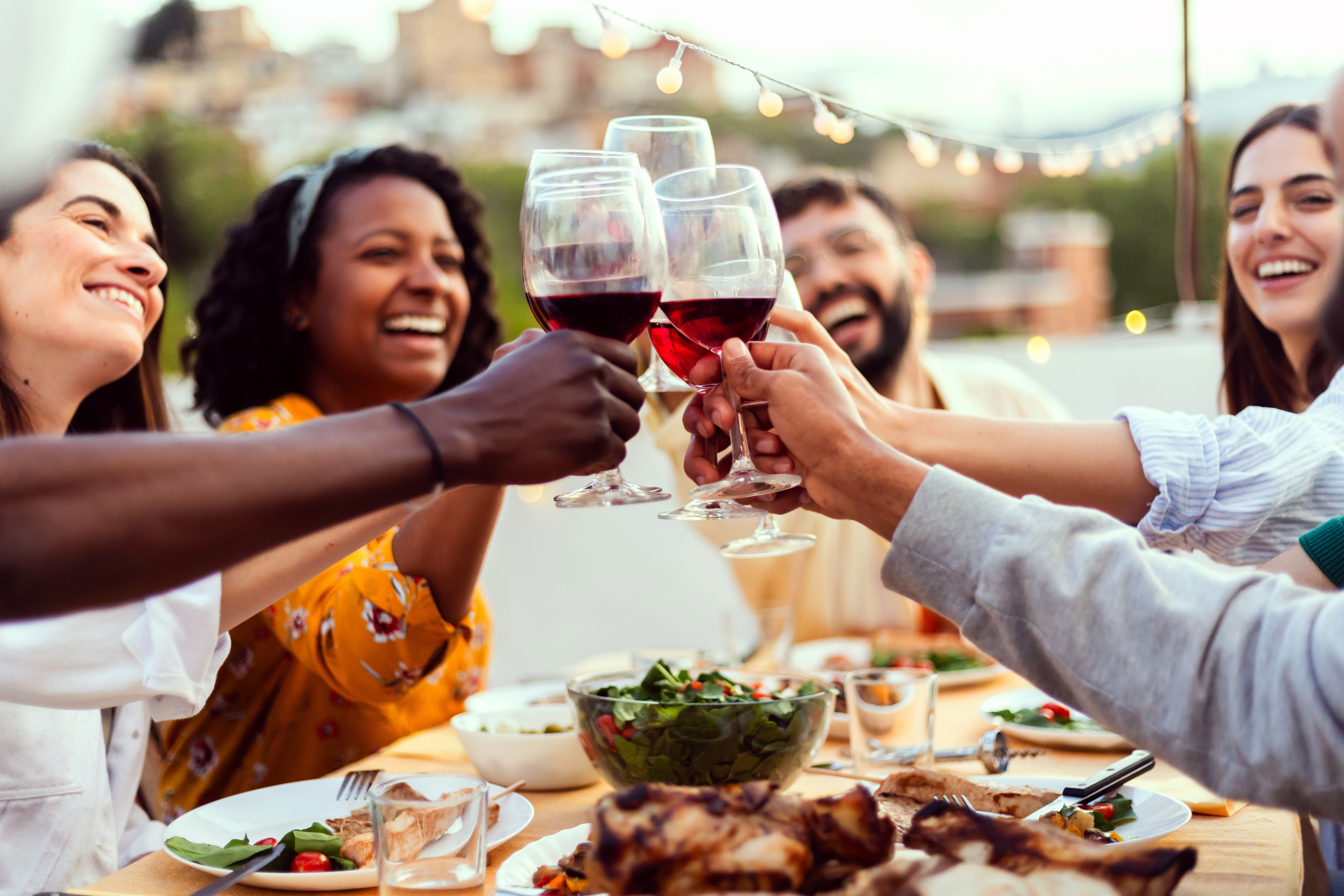 People eating at table outside stock image
