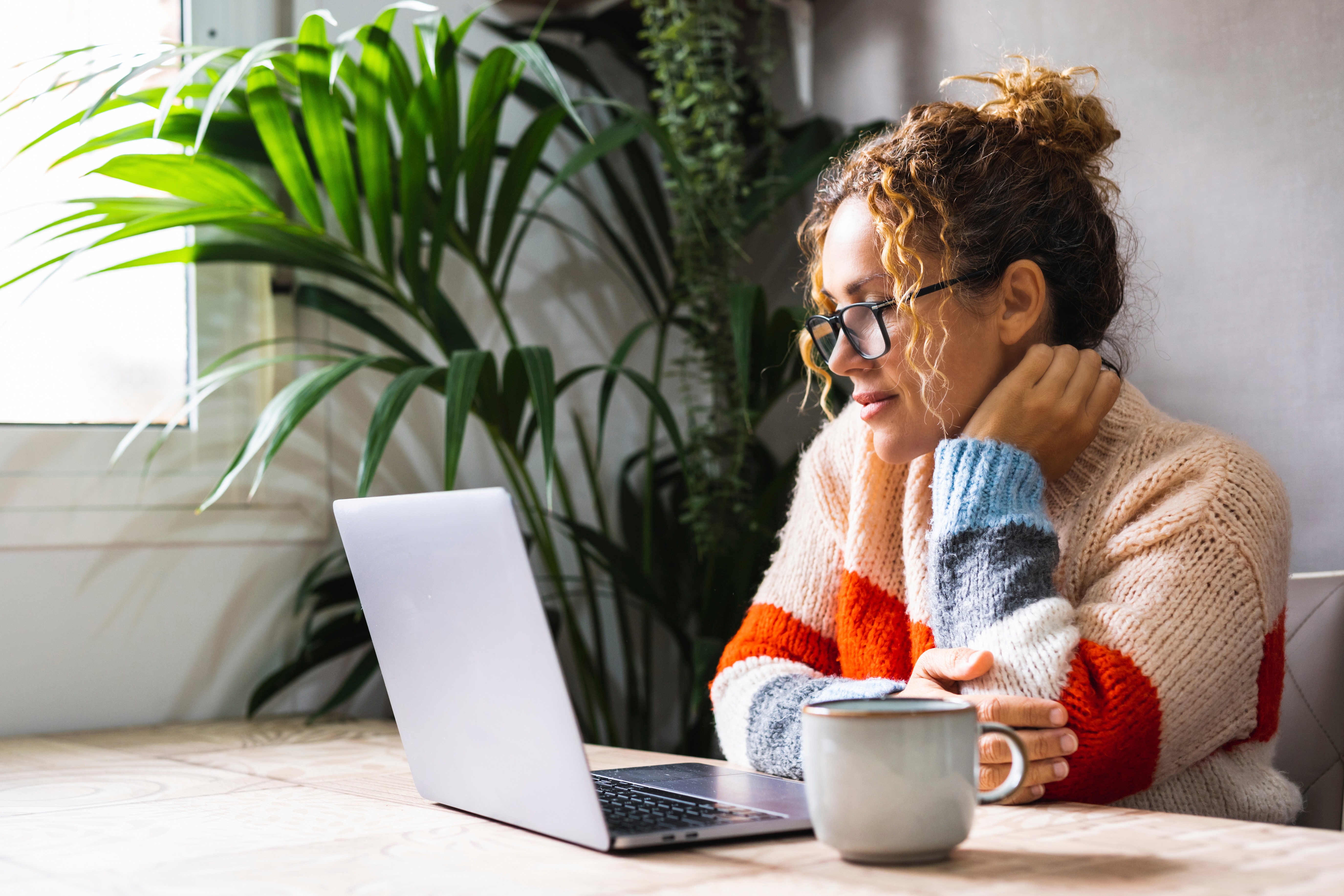 Woman reading laptop stock image