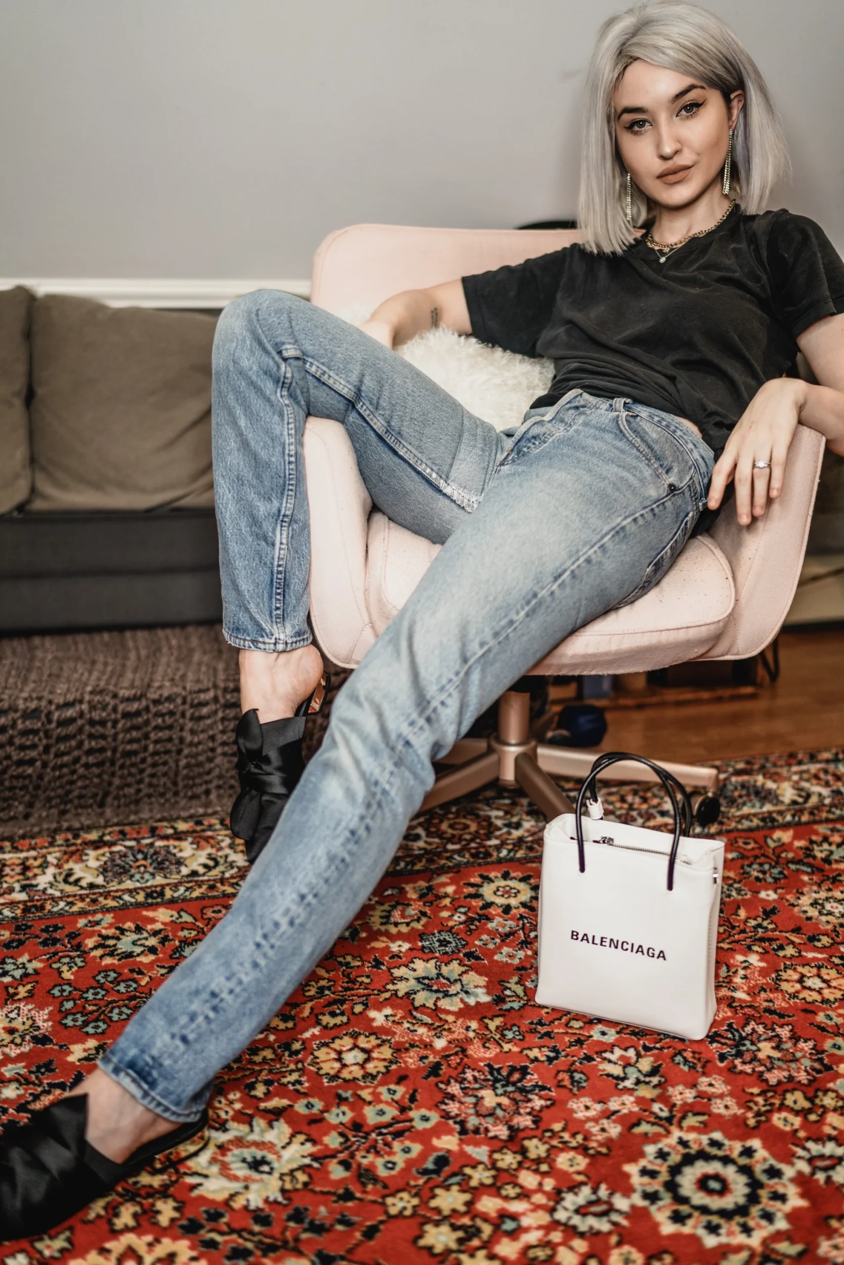 fashion model sitting in a chair