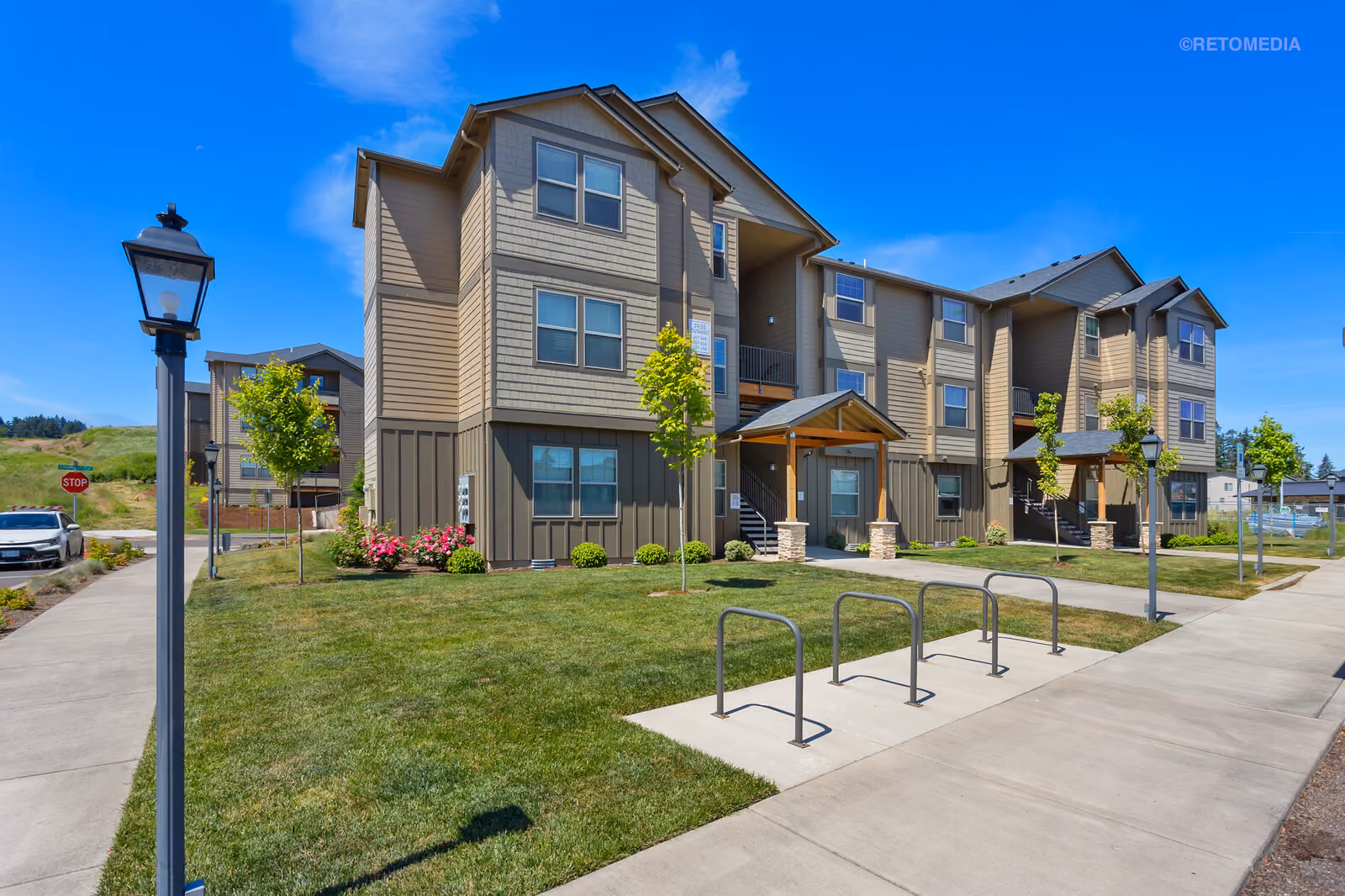 Modern apartments with landscaped walkway at The Grove in Salem, Oregon