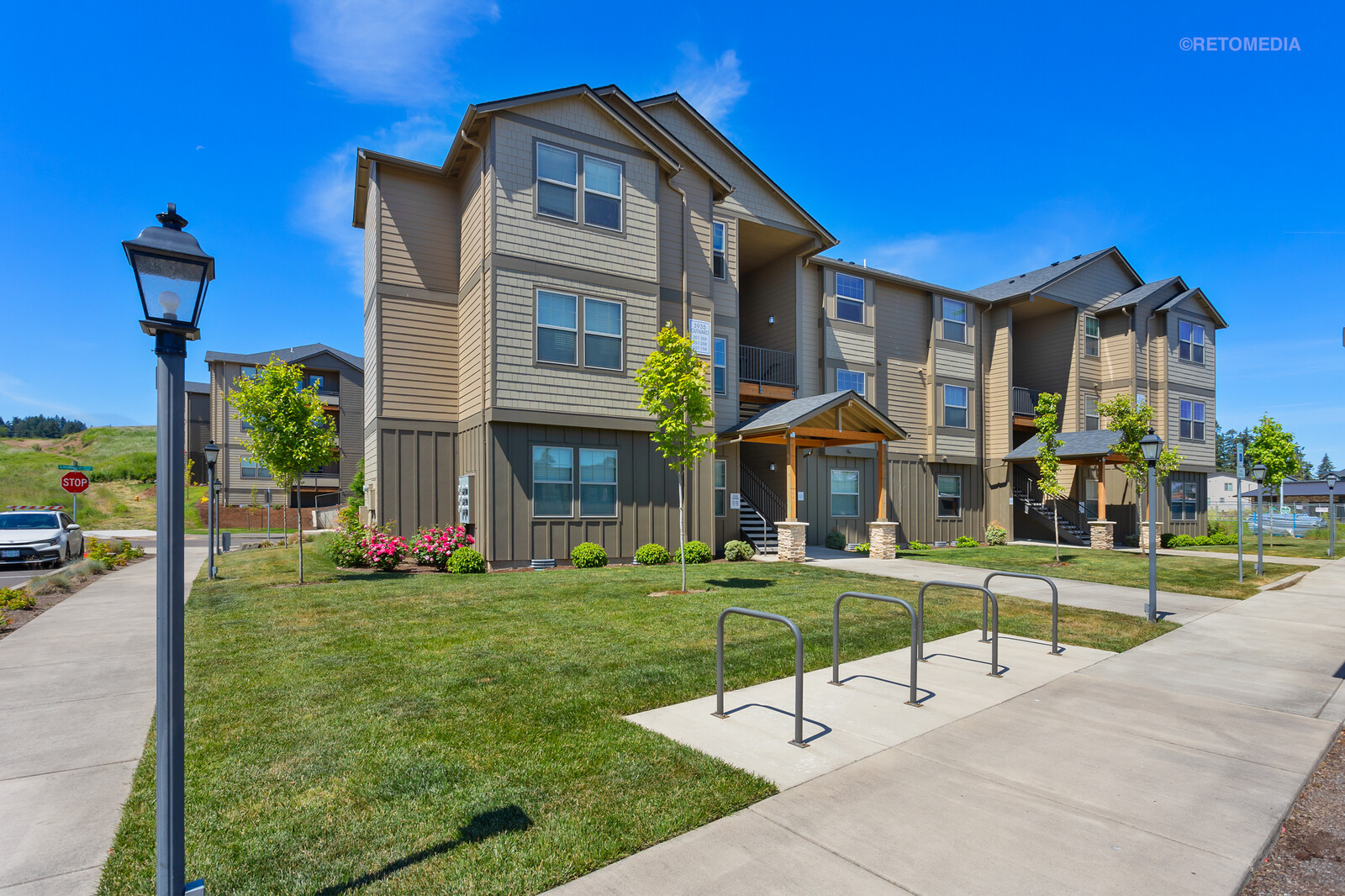 Modern apartments with landscaped walkway at The Grove in Salem, Oregon