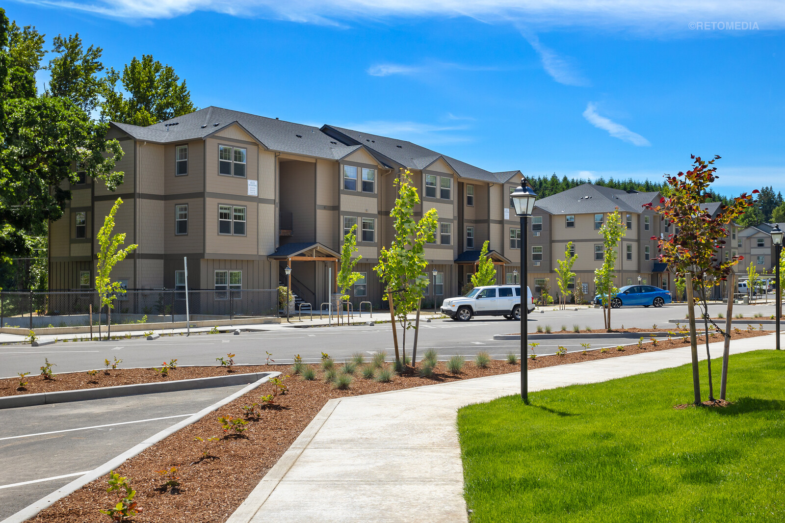 Modern apartments with landscaped walkway at The Grove in Salem, Oregon