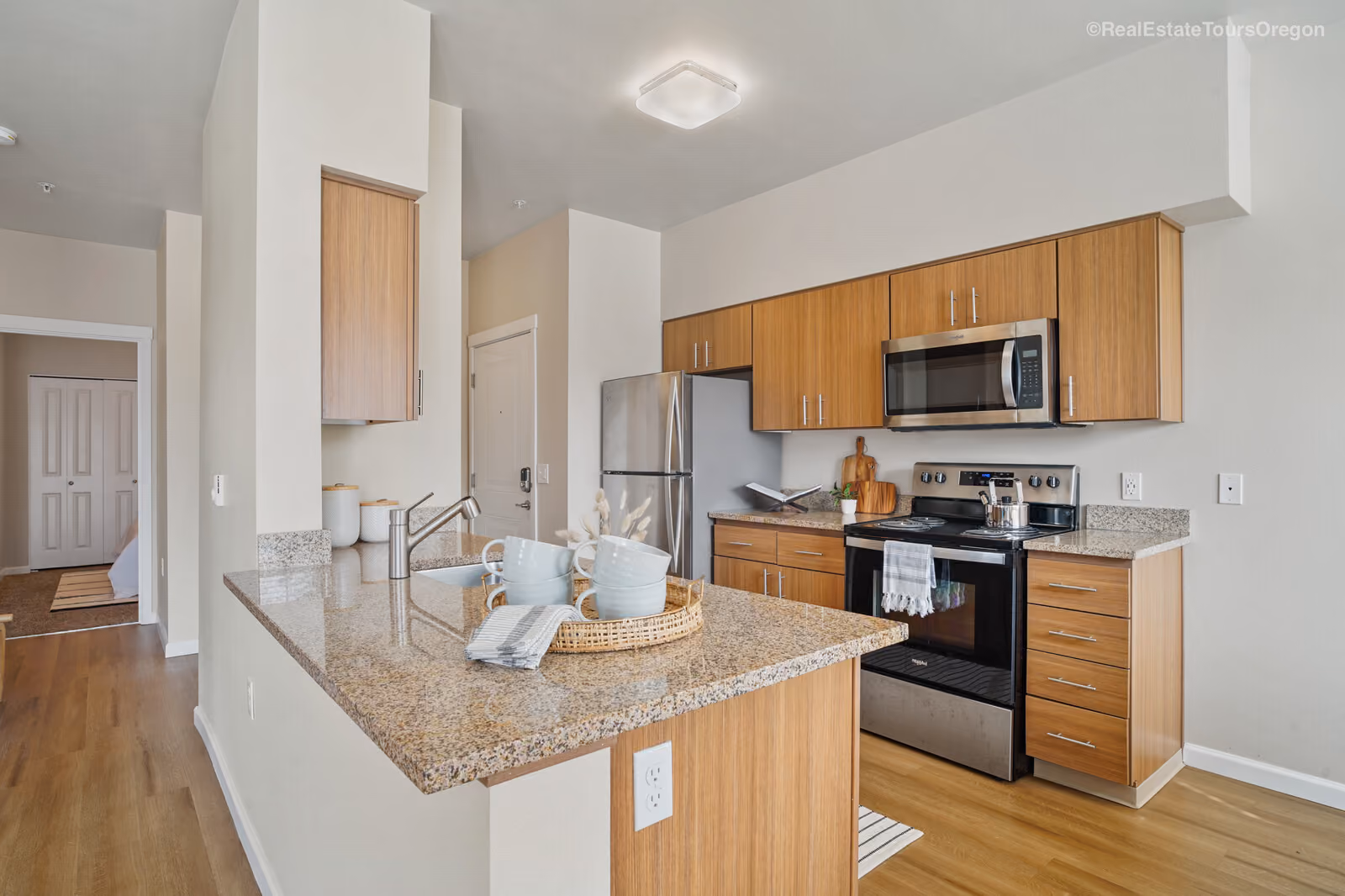 Modern kitchen with wood cabinets at The Grove in Salem, Oregon