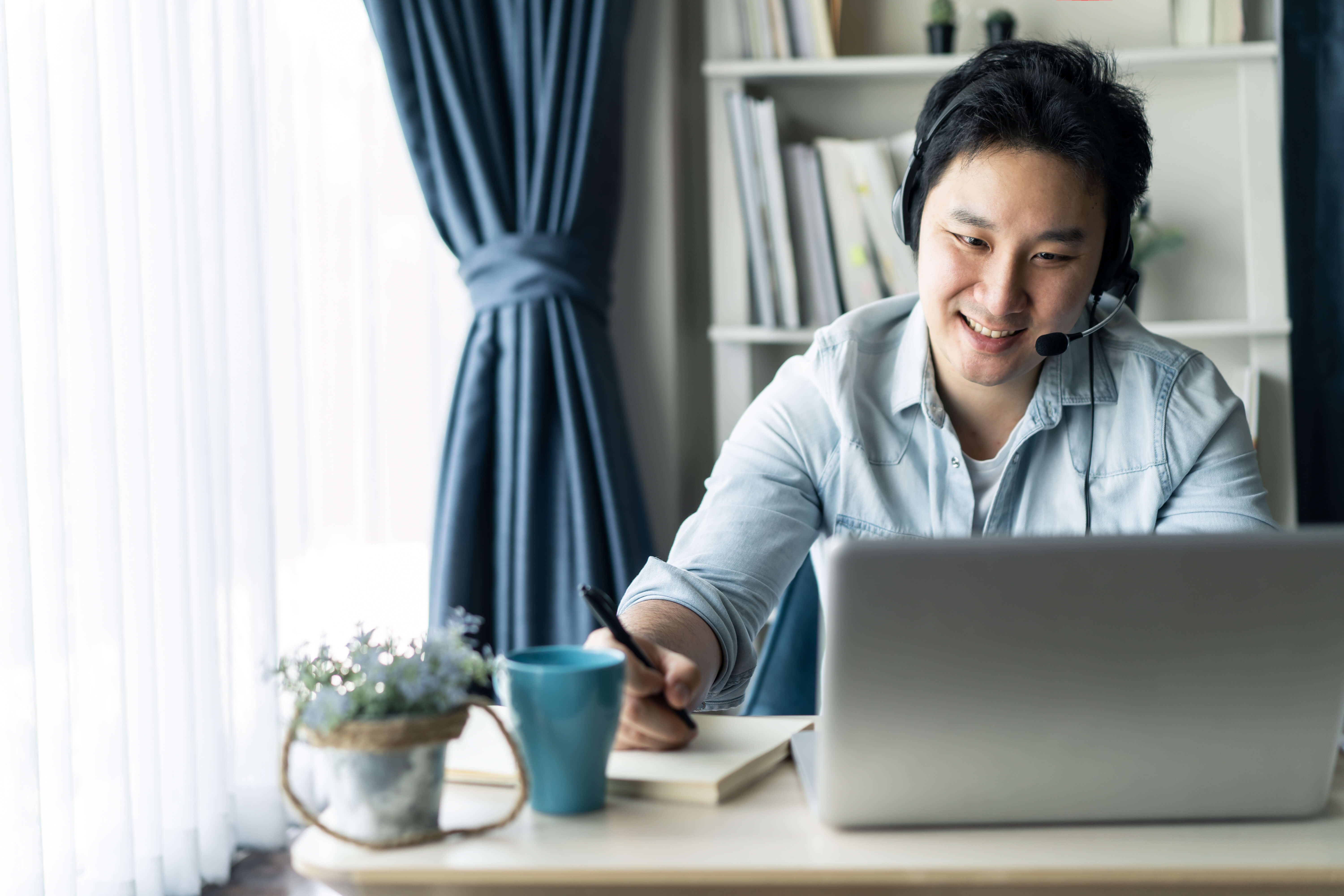 Man on a telehealth video call from home