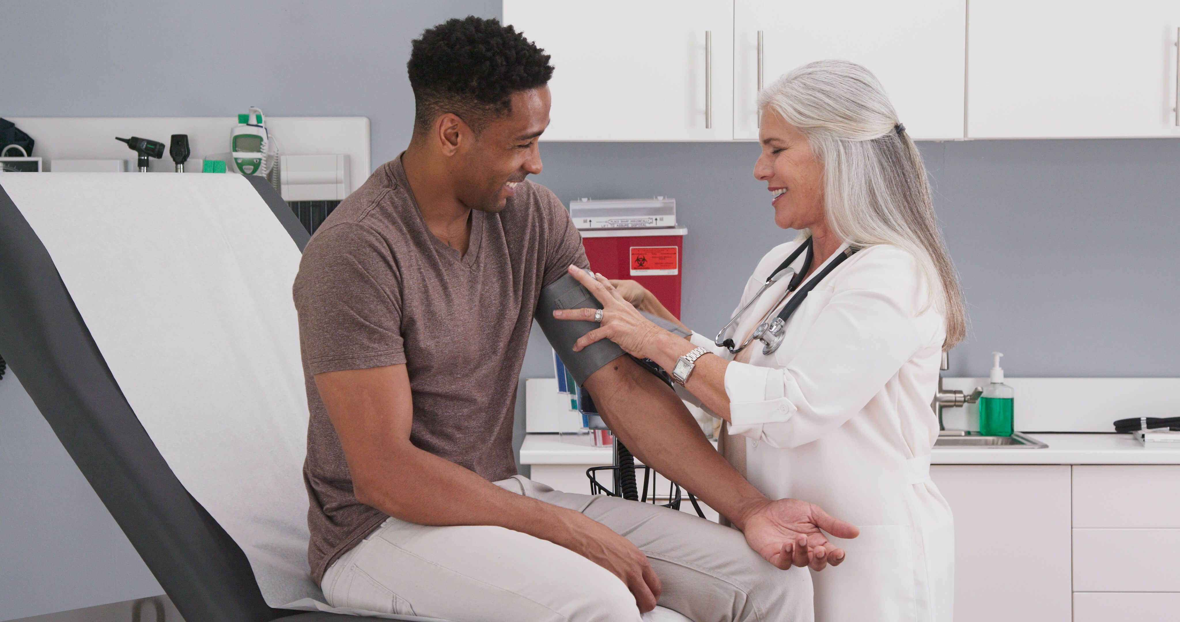 Clinician checking a patient’s blood pressure