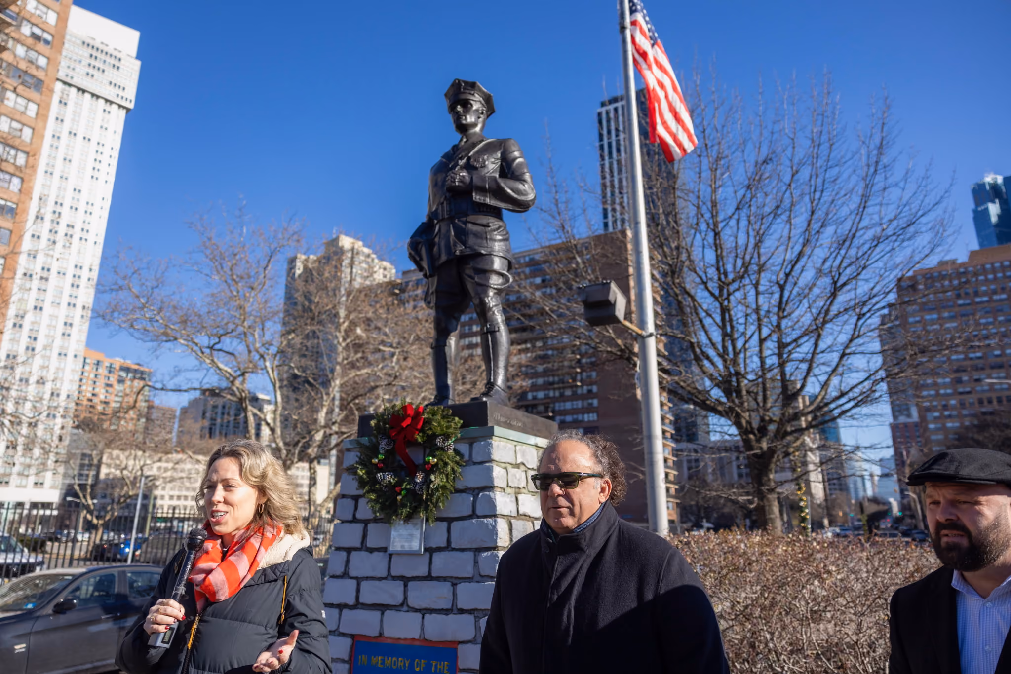 Community members gathered at the statue