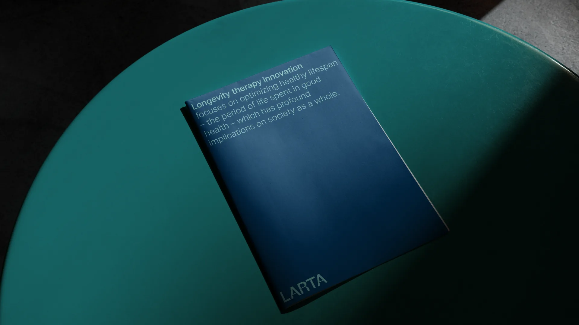 Longevity therapy brochure on a teal table