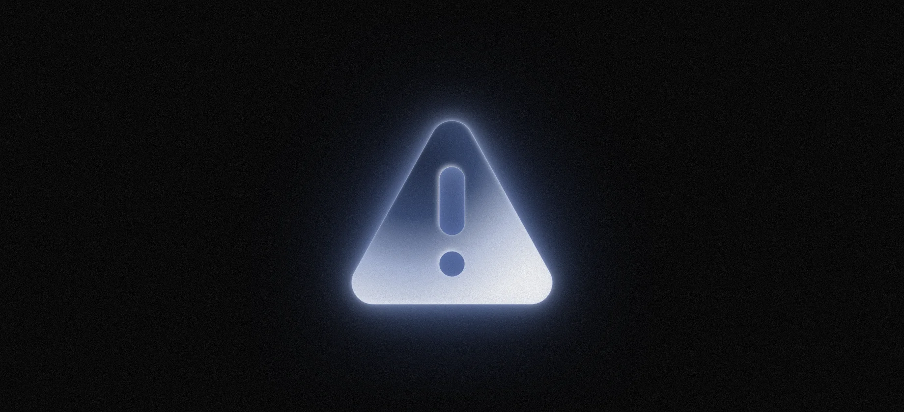 Glowing warning triangle with an exclamation mark on a dark background