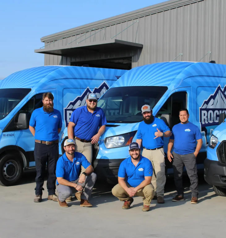 Rockwater Plumbing team with fleet of service vans