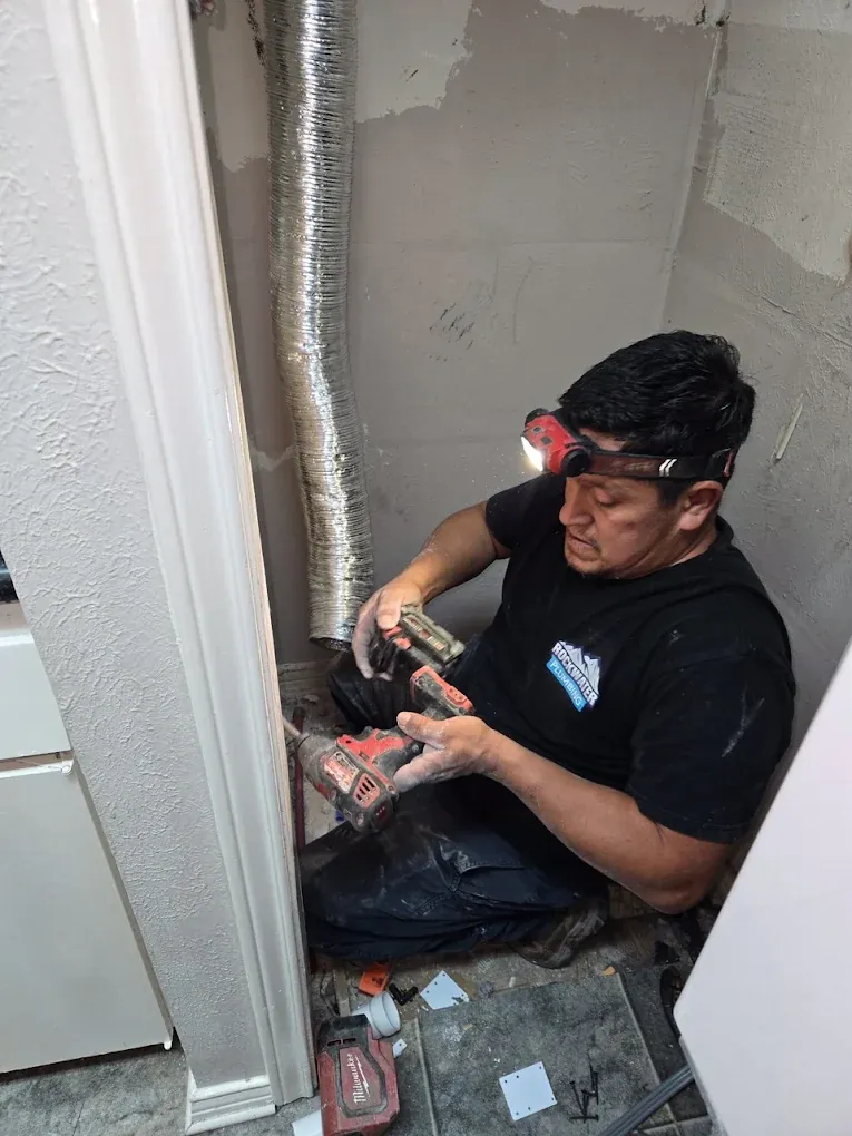 Rockwater Plumbing team with service van