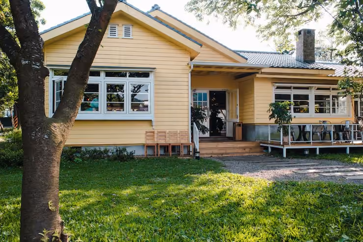 Weatherboard home with a front verandah and lawn