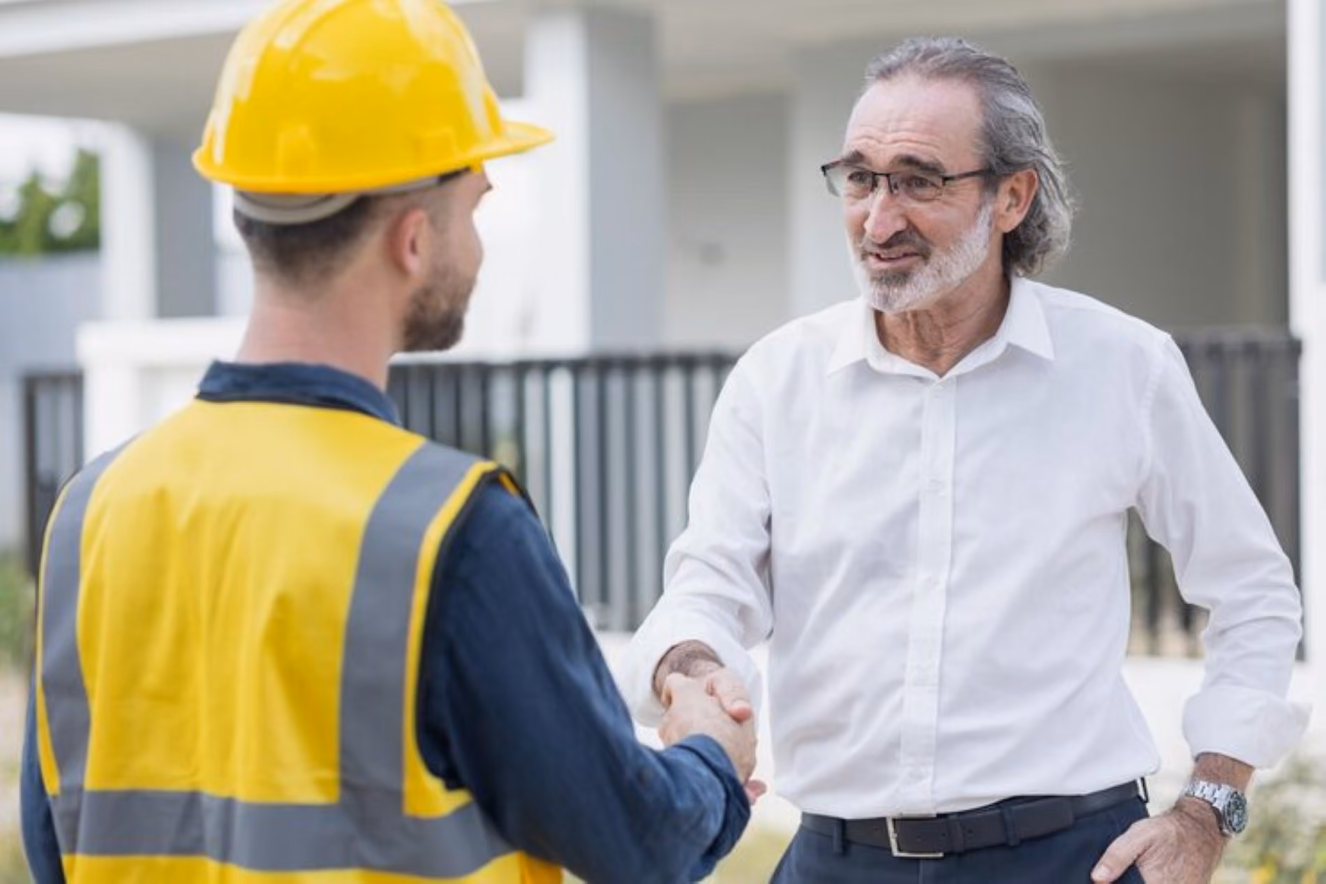 Tradesperson shaking hands with a client