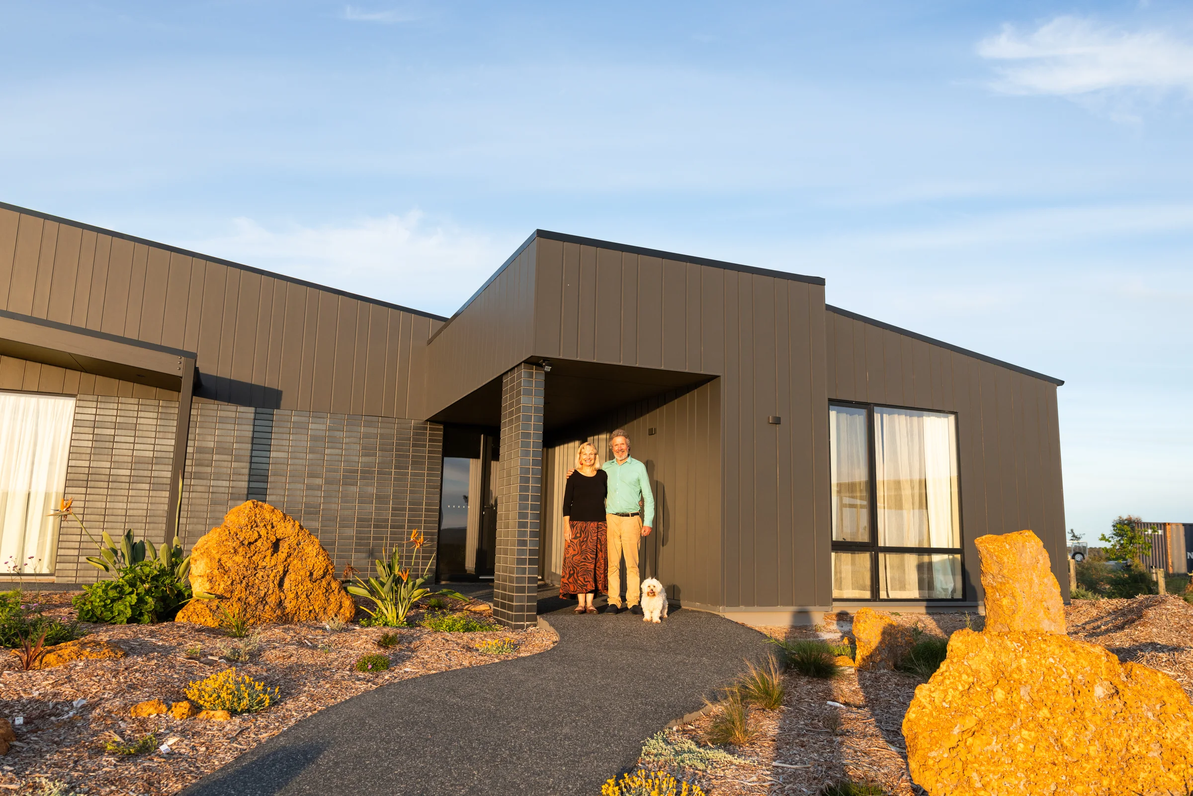The owners at the front entry of their new home in Denmark, WA