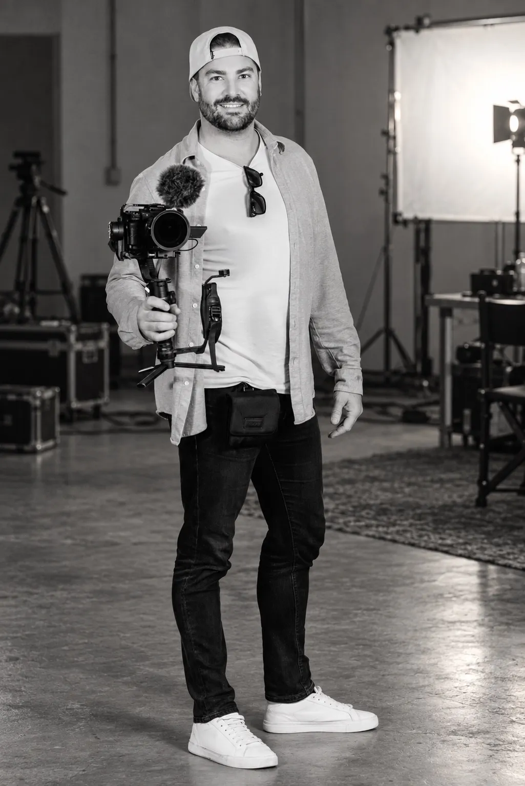 Chris Cole holding a camera on an indie film set