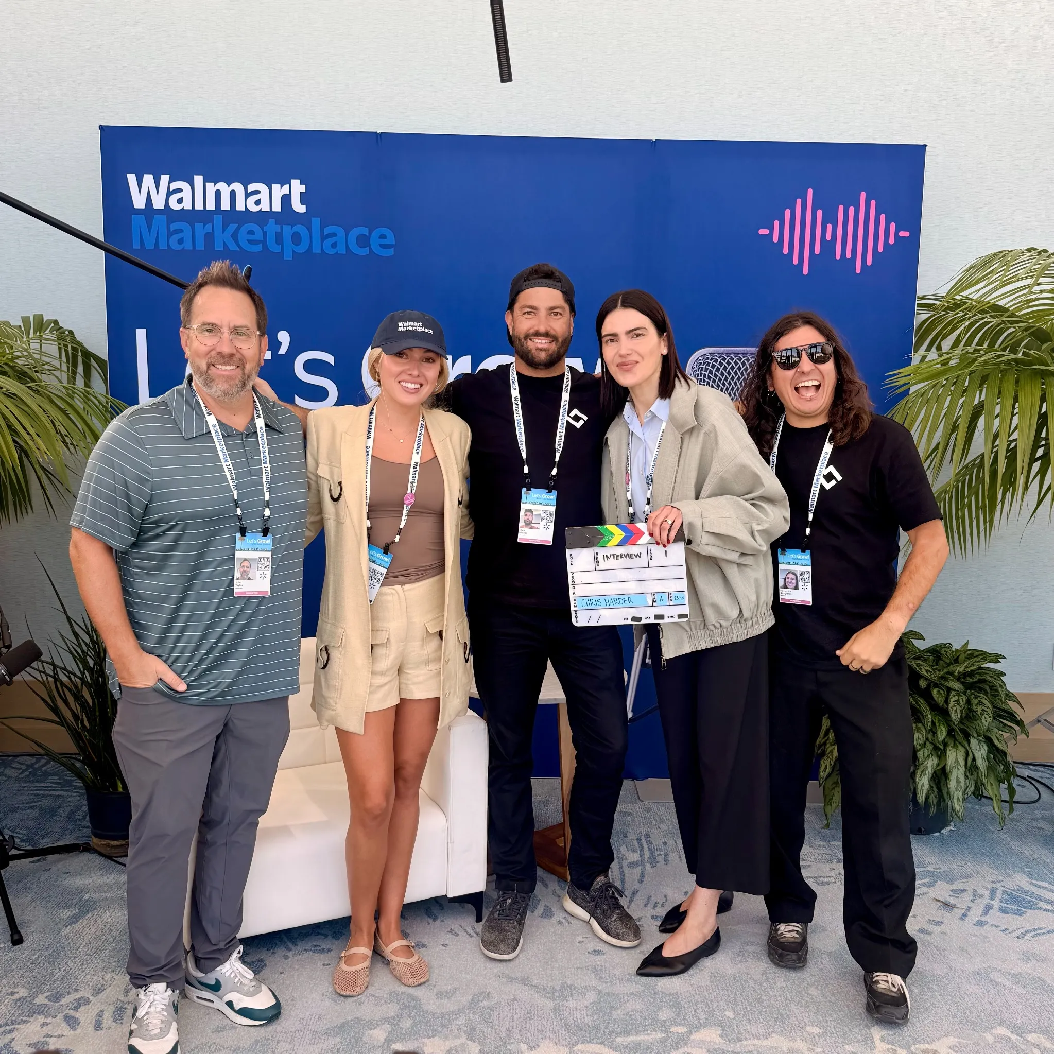 Walmart Marketplace interview crew posing together with a film slate