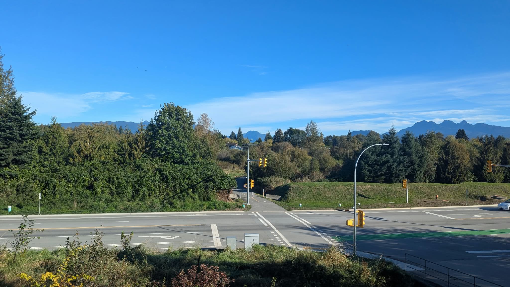 Residential intersection in Pitt Meadows with the Golden Ears mountains in the background