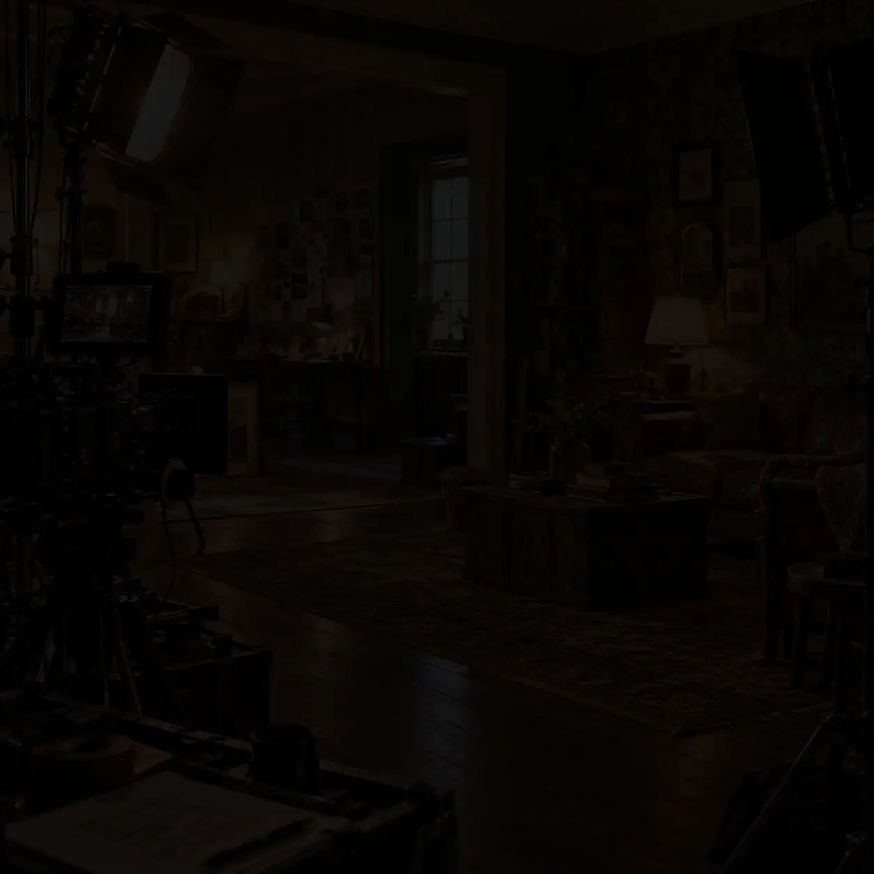 Behind the scenes film set with director’s chair, camera rig on dolly, lighting equipment, and staged living room scene during production shoot
