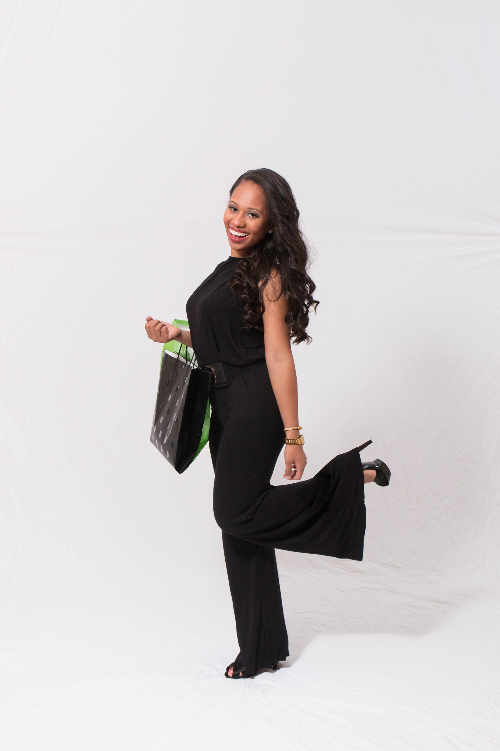 ProntoWash Eco AutoSpa campaign model posing with branded shopping bags.