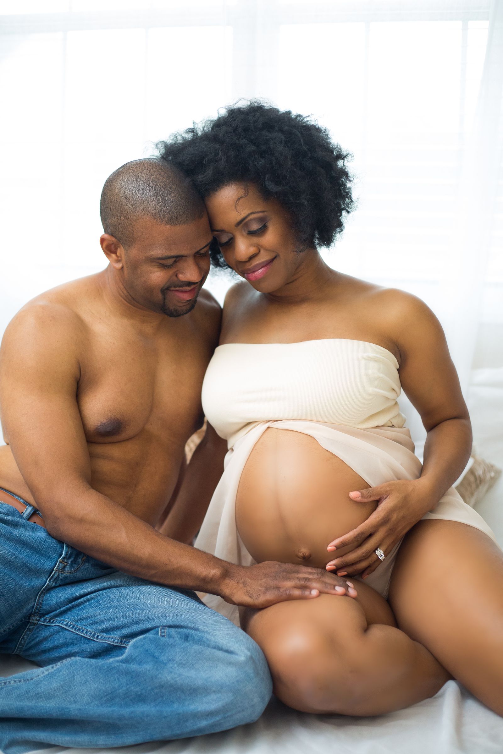 At-home maternity portrait photographed by ART Studios