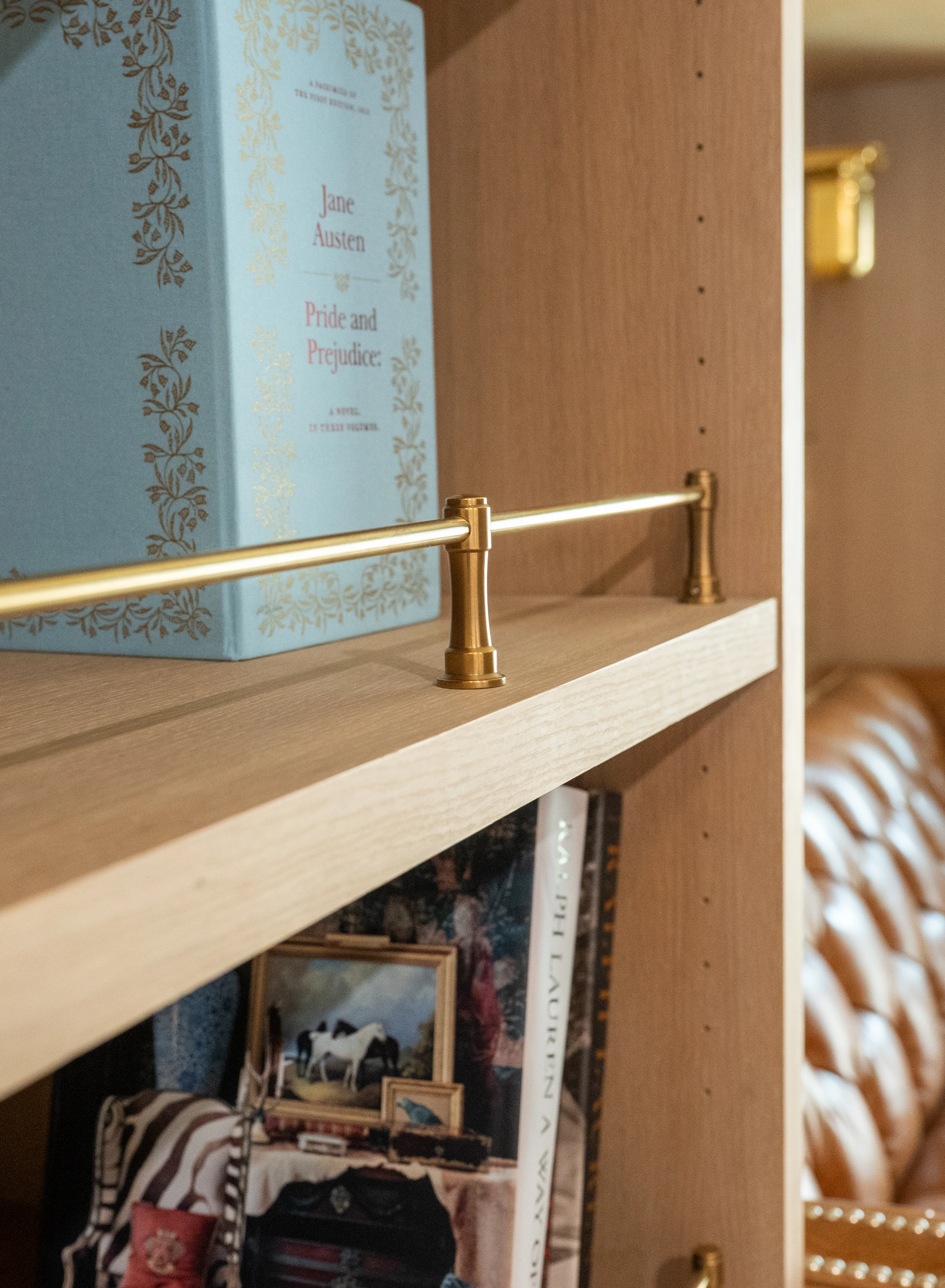 Close view of brass detailing and shelving at Hart.