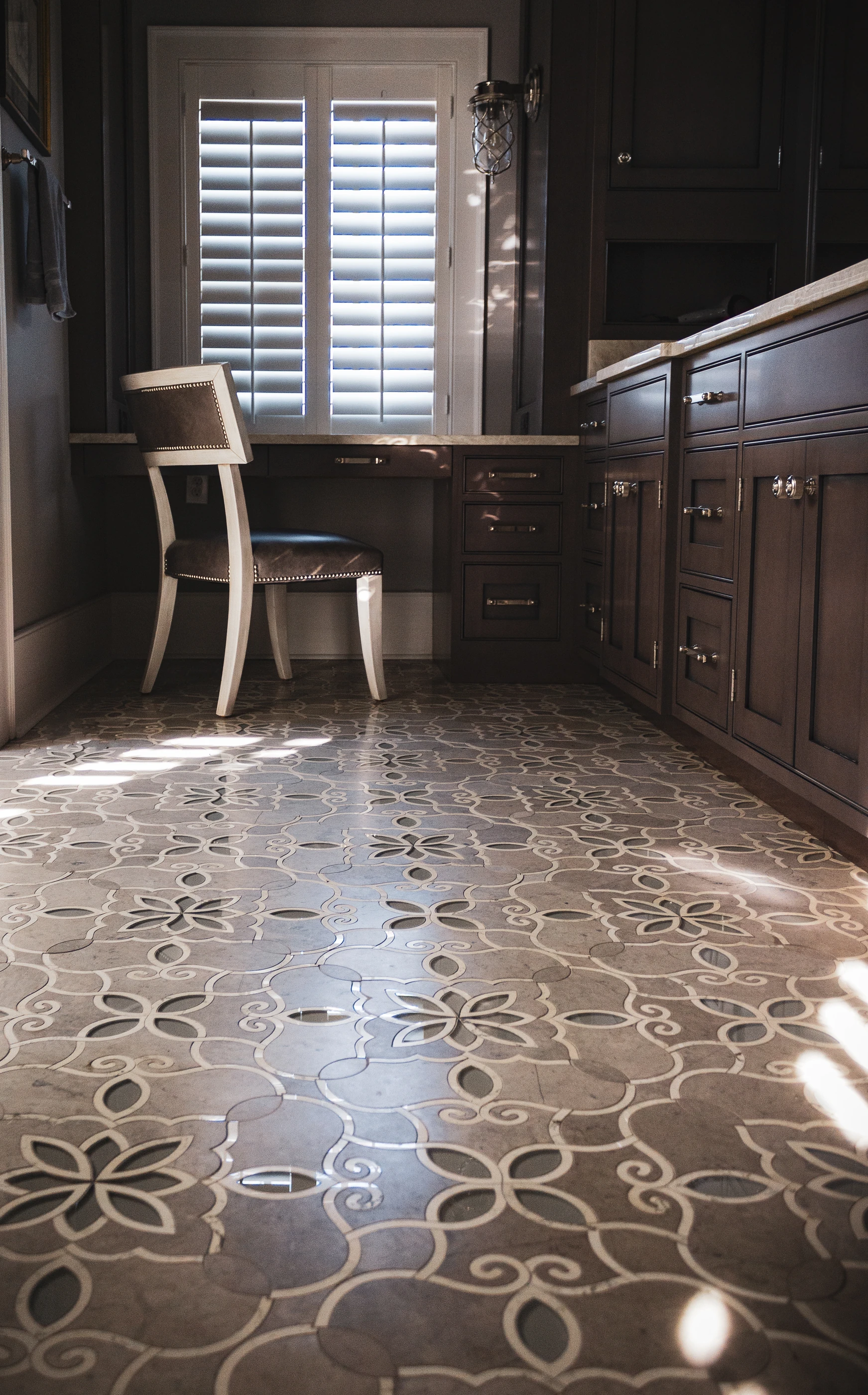 Reed Farm bath with a patterned floor, traditional fixtures and layered decorative finishes.