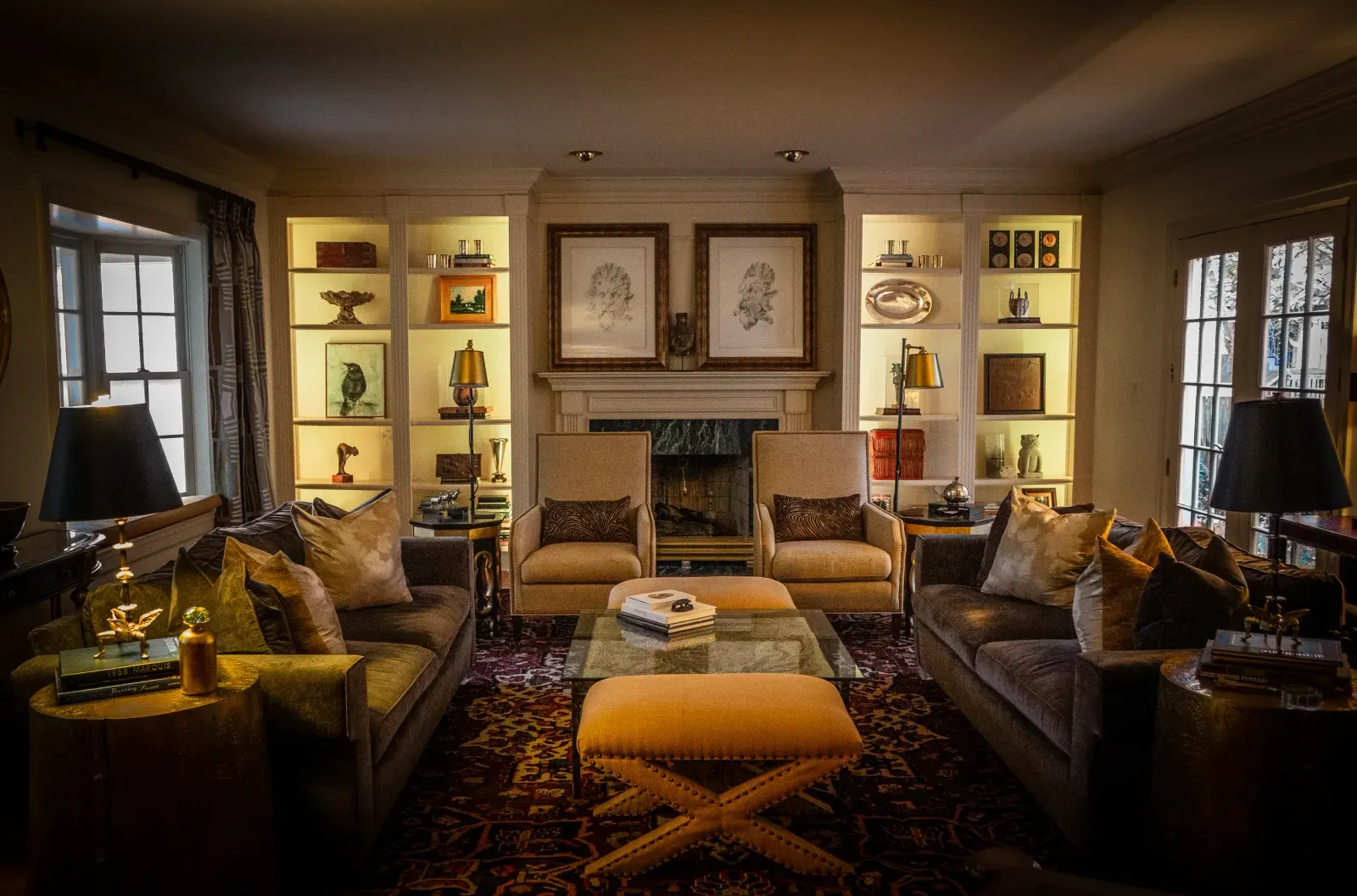 Layered seating and illuminated shelves in an Ashland Park living room