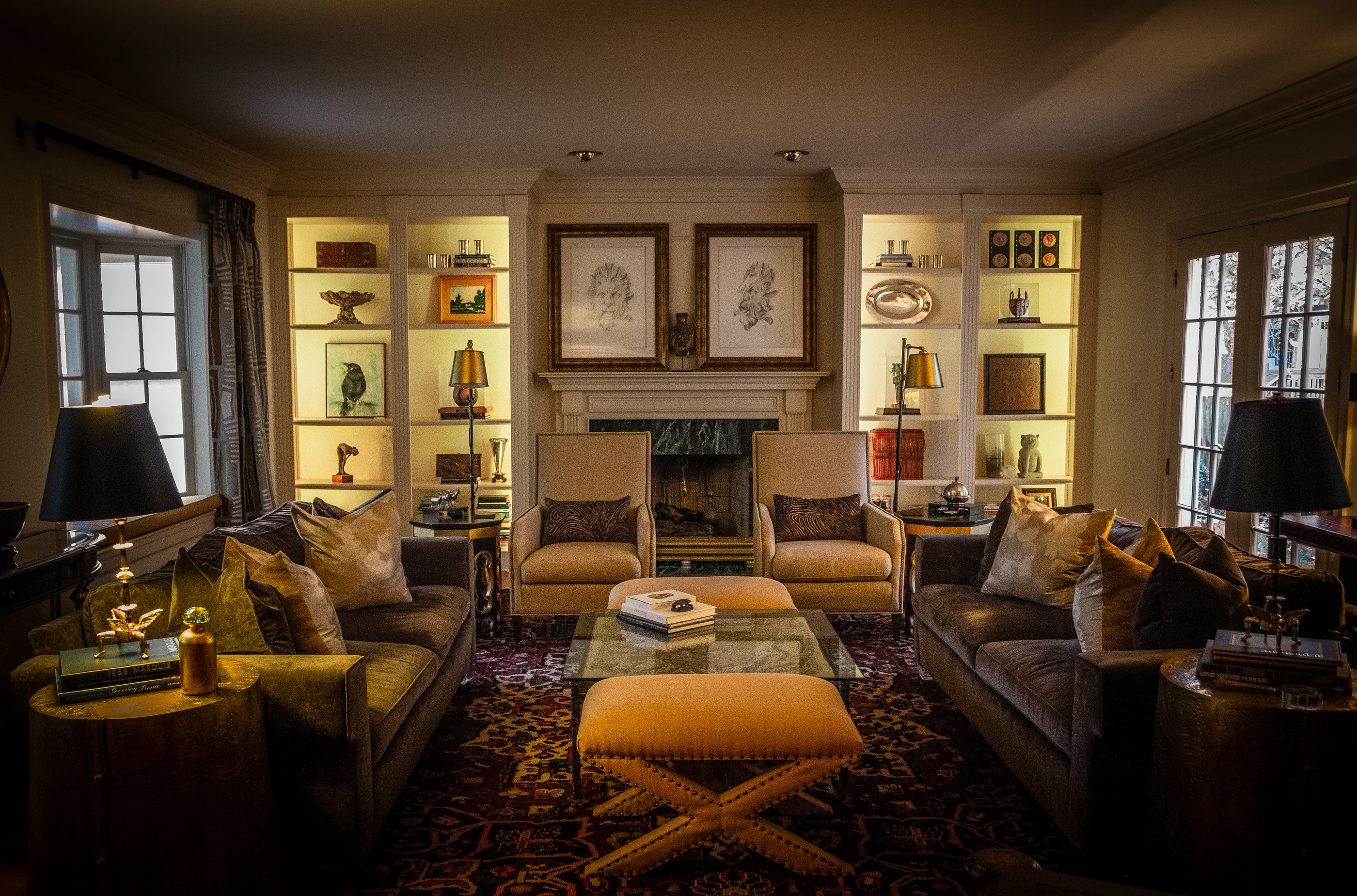 Ashland Park living room with illuminated shelves, a fireplace and layered seating.
