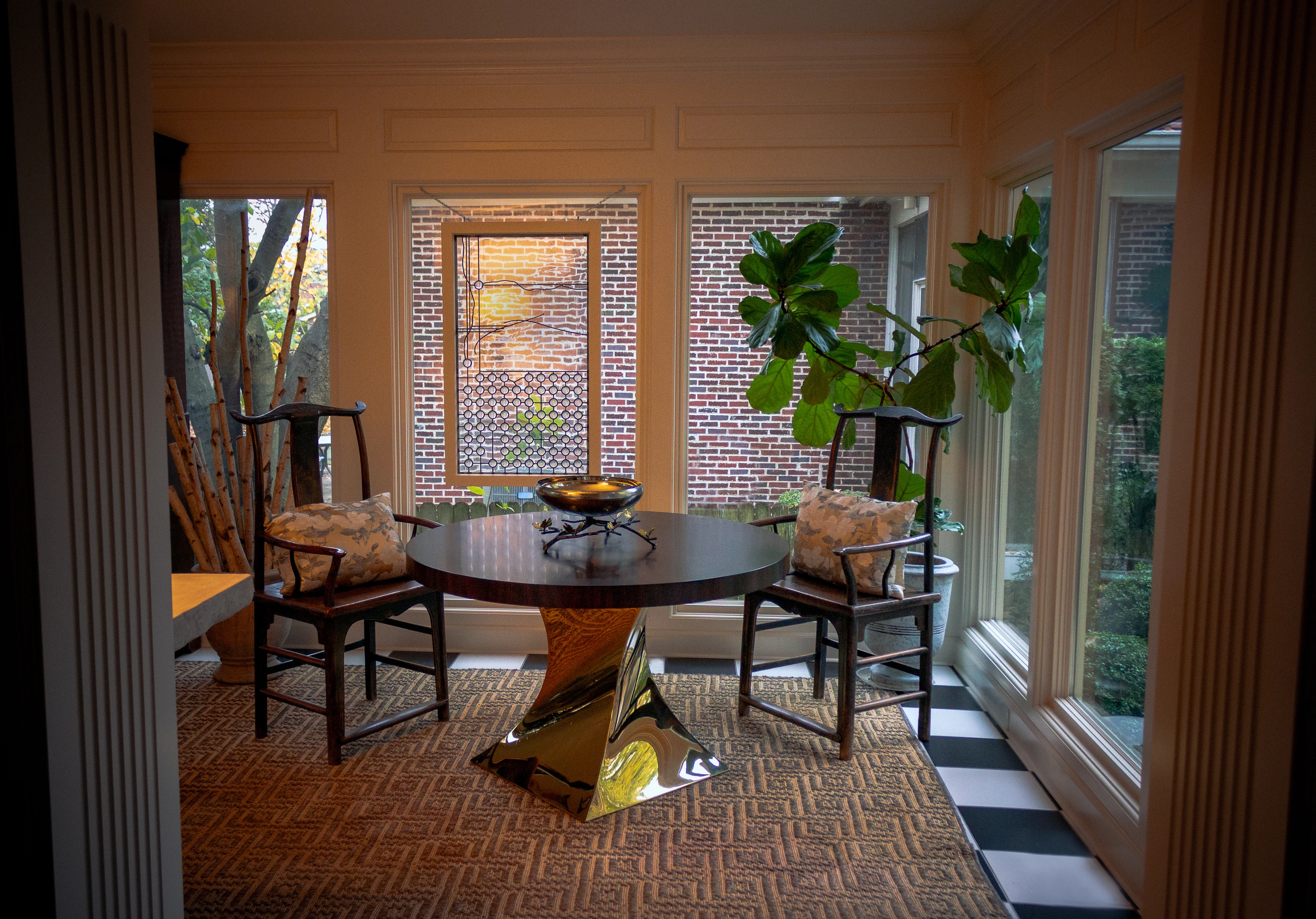 Ashland Park breakfast room with a round table, upholstered chairs and patterned wallcovering.
